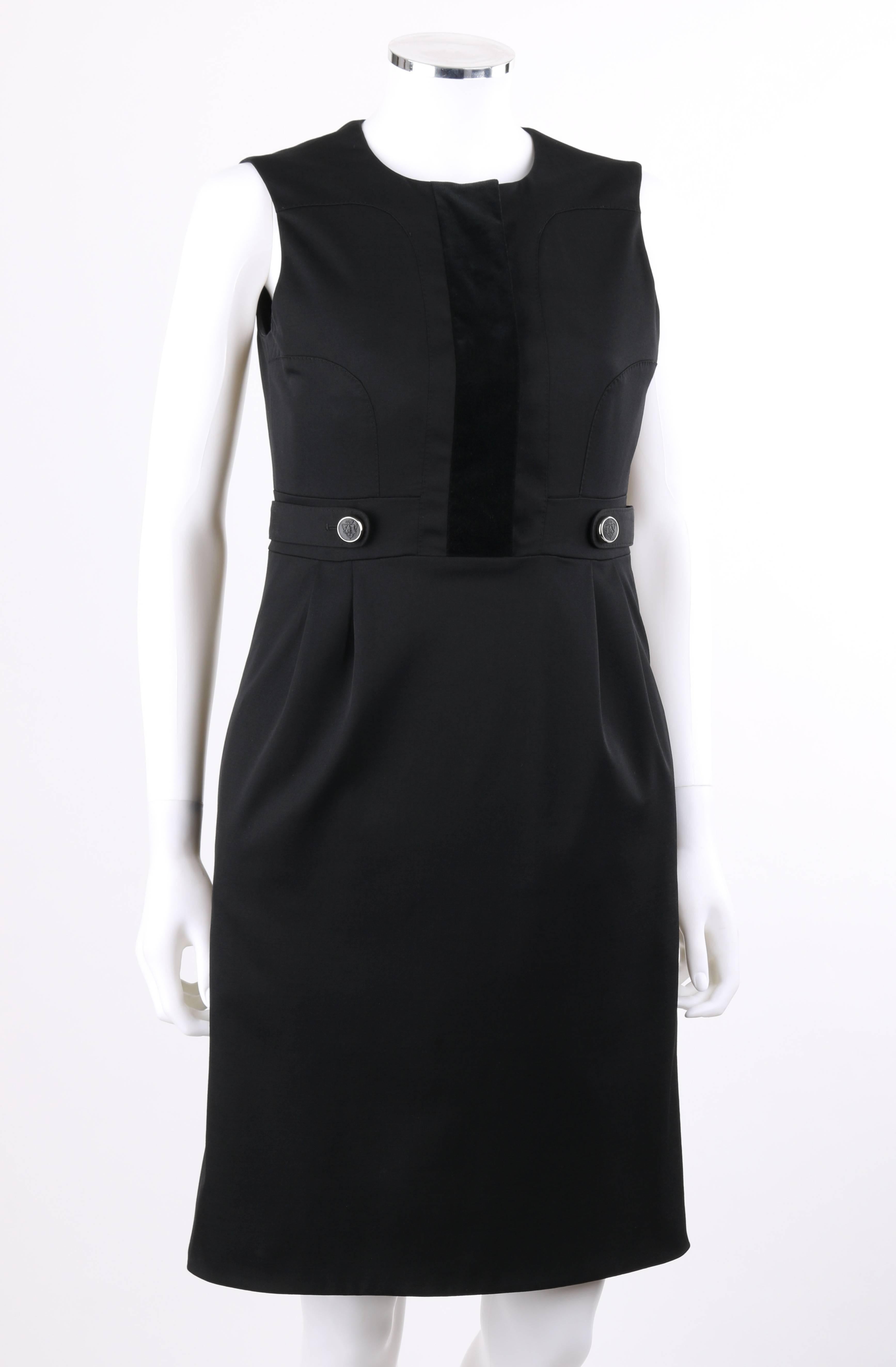 Gucci Autumn/Winter 2007 black wool cotton sleeveless cocktail dress; New with tags. Scoop neckline. Center front velvet panel with eight hidden hook and eye closures. Princess seams. Banded waist with button and tab detail. Four front knife pleats
