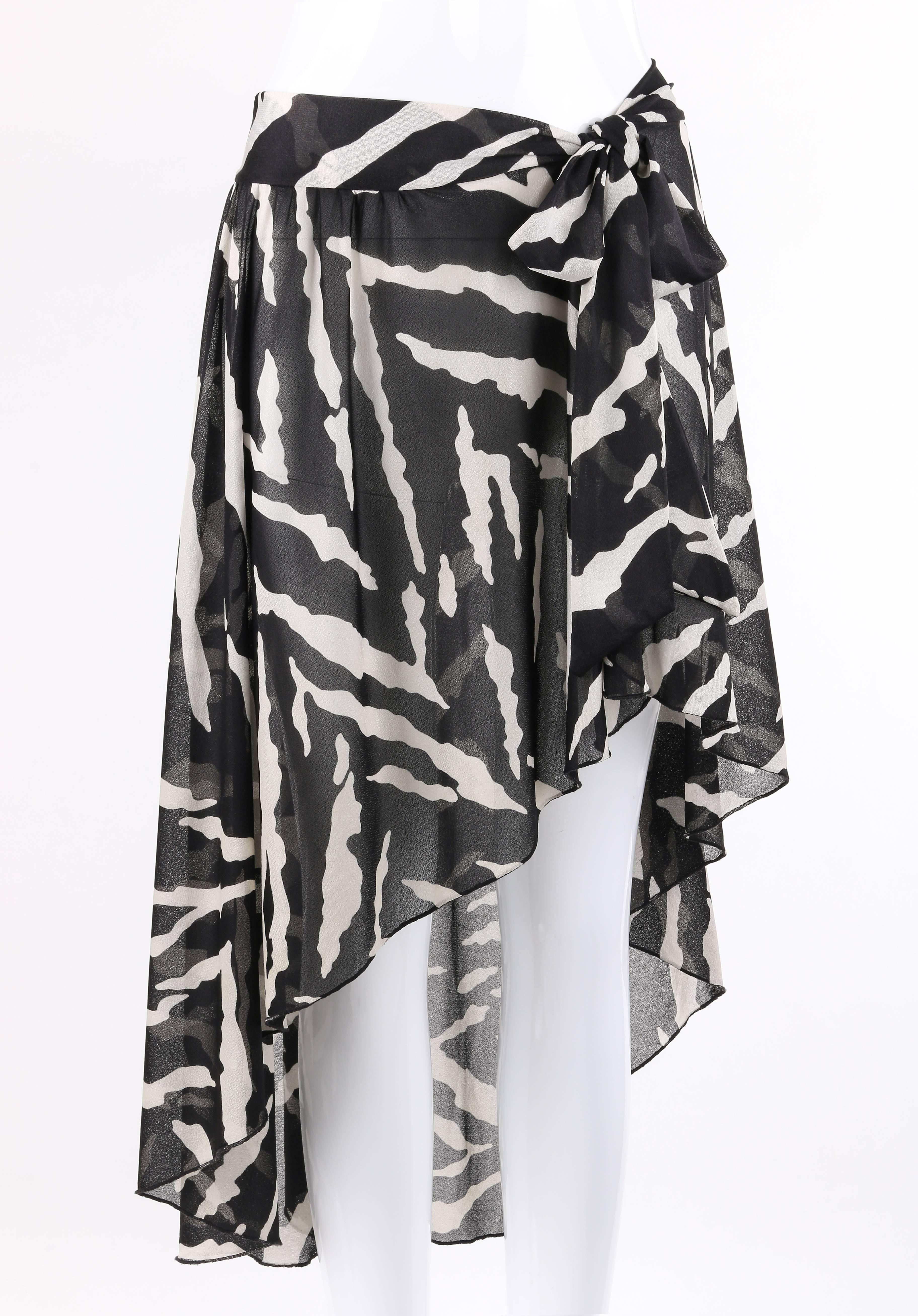 Vintage Oscar de la Renta Swimwear c.1980's black and white zebra print beachwear cover up. Bias cut. Banded tie waist. Asymmetrical hi-low hem. Lightly gathered skirt. Marked Fabric Content: 