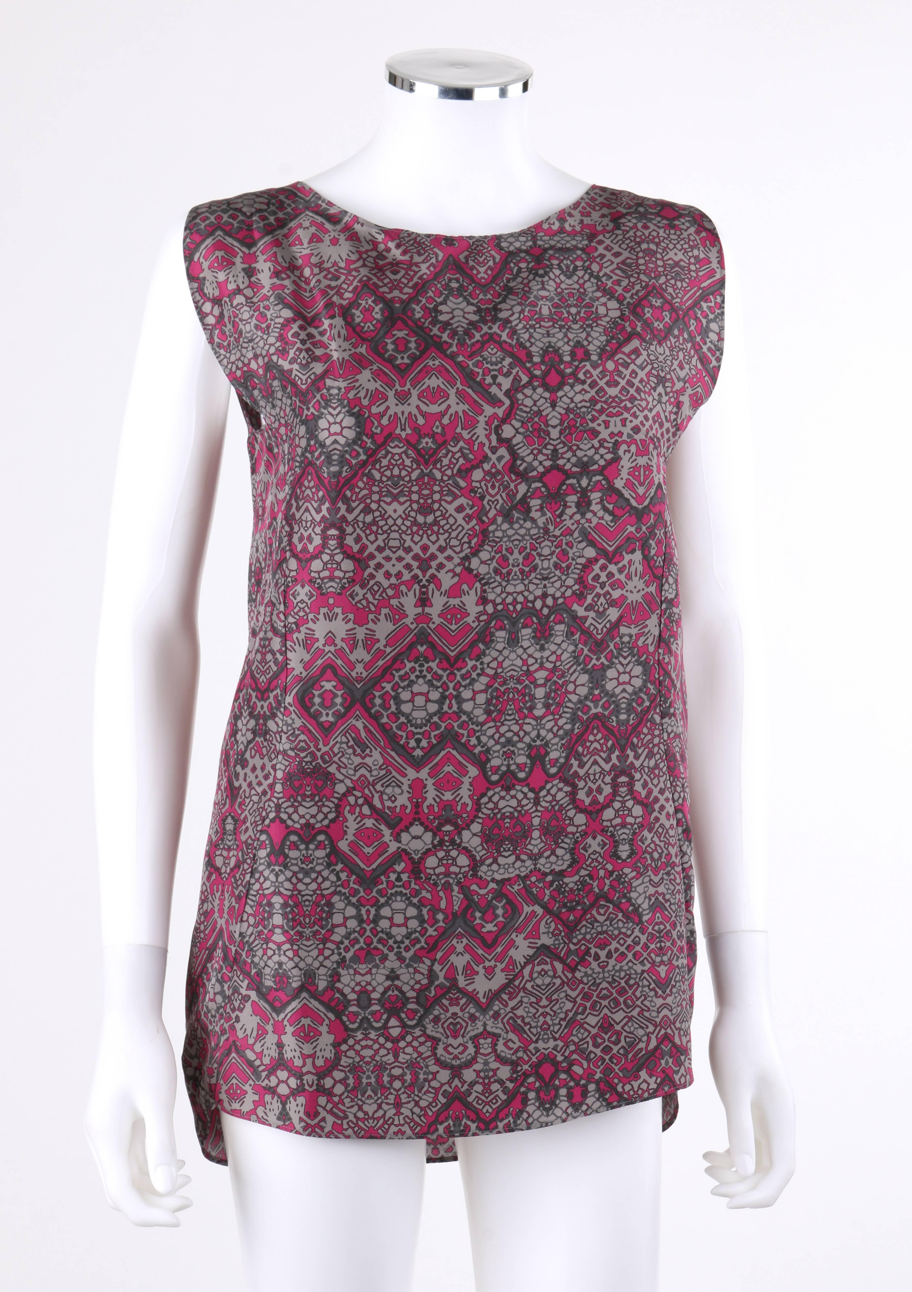 Yves Saint Laurent Spring/Summer 2012 Gray and magenta abstract print silk blouse; New with tags. All over abstract kaleidoscope pattern in shades of gray and magenta. Wide scoop neckline. Extended shoulders. Princess seams for contoured shape.