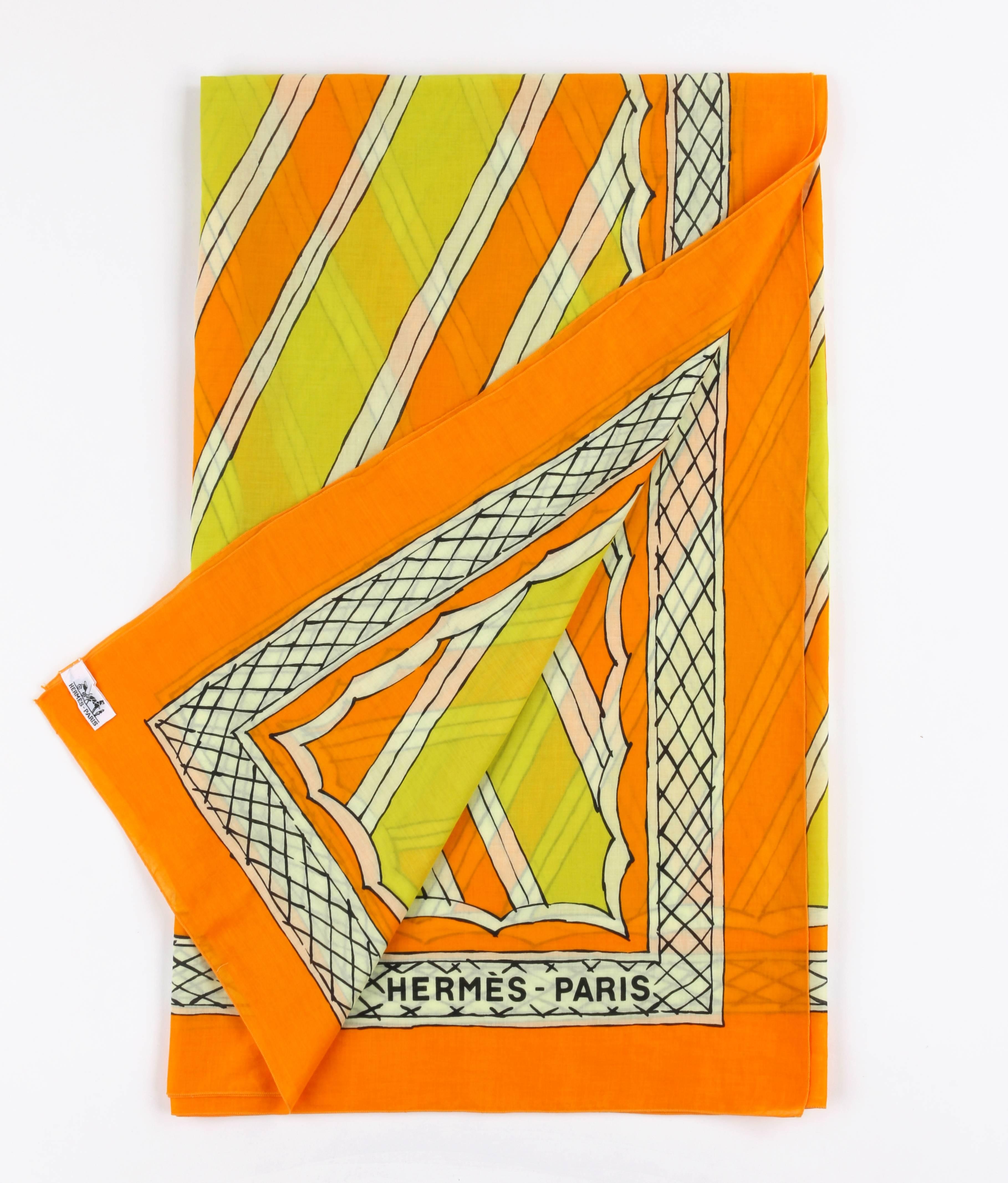 Tan France Auction Pick

Hermes large orange and yellow cotton multi-use scarf. Orange, yellow, and winter white diagonal striped painterly design at center with scalloped edge. Winter white and back crosshatched boarder print. Orange background.