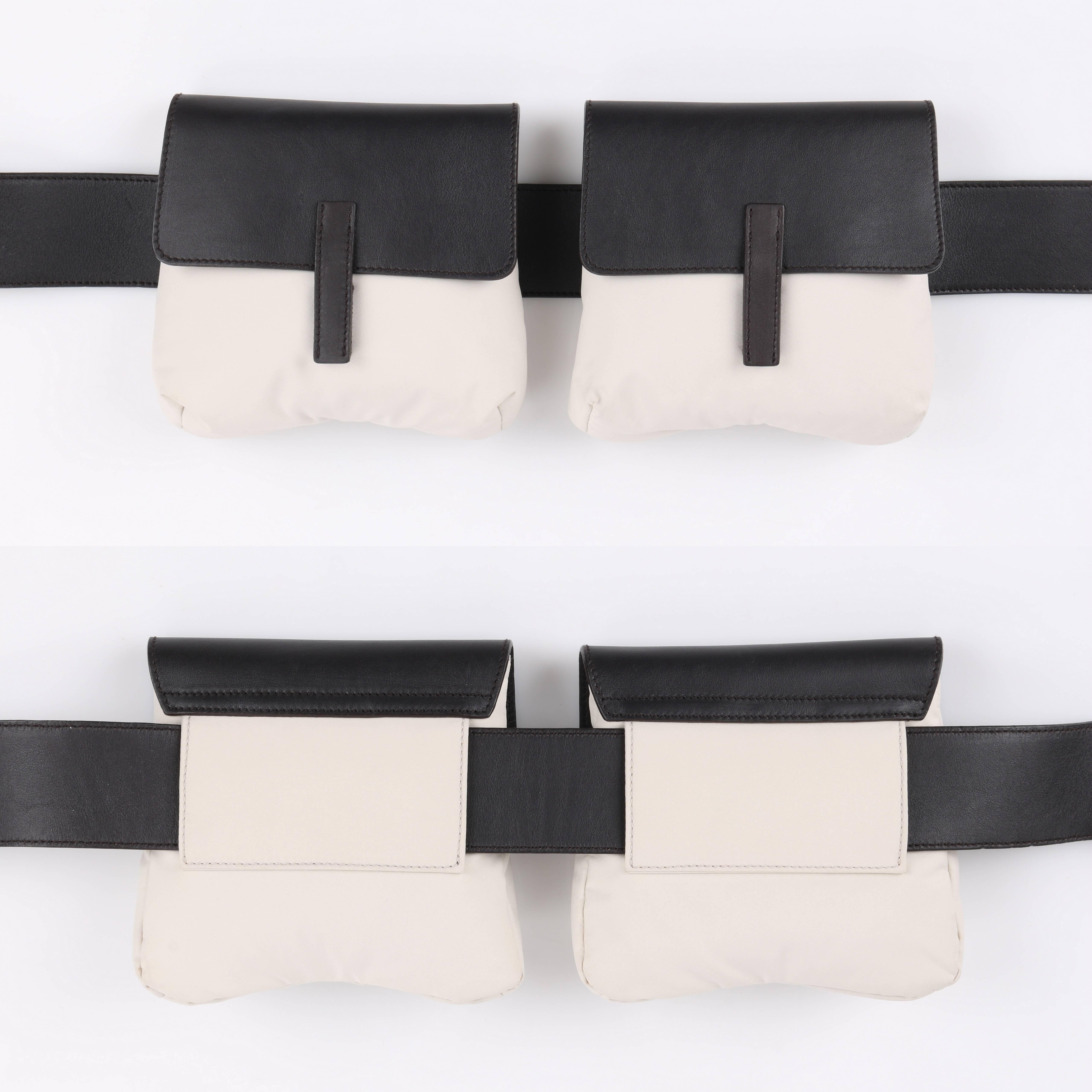 Prada Sport dark brown leather and beige nylon waist belt bag. Two pouches with beige nylon body. Brown leather flap top with velcro closure. Fully lined with brown nylon. Center back tab for removal from belt. Brown leather adjustable belt with
