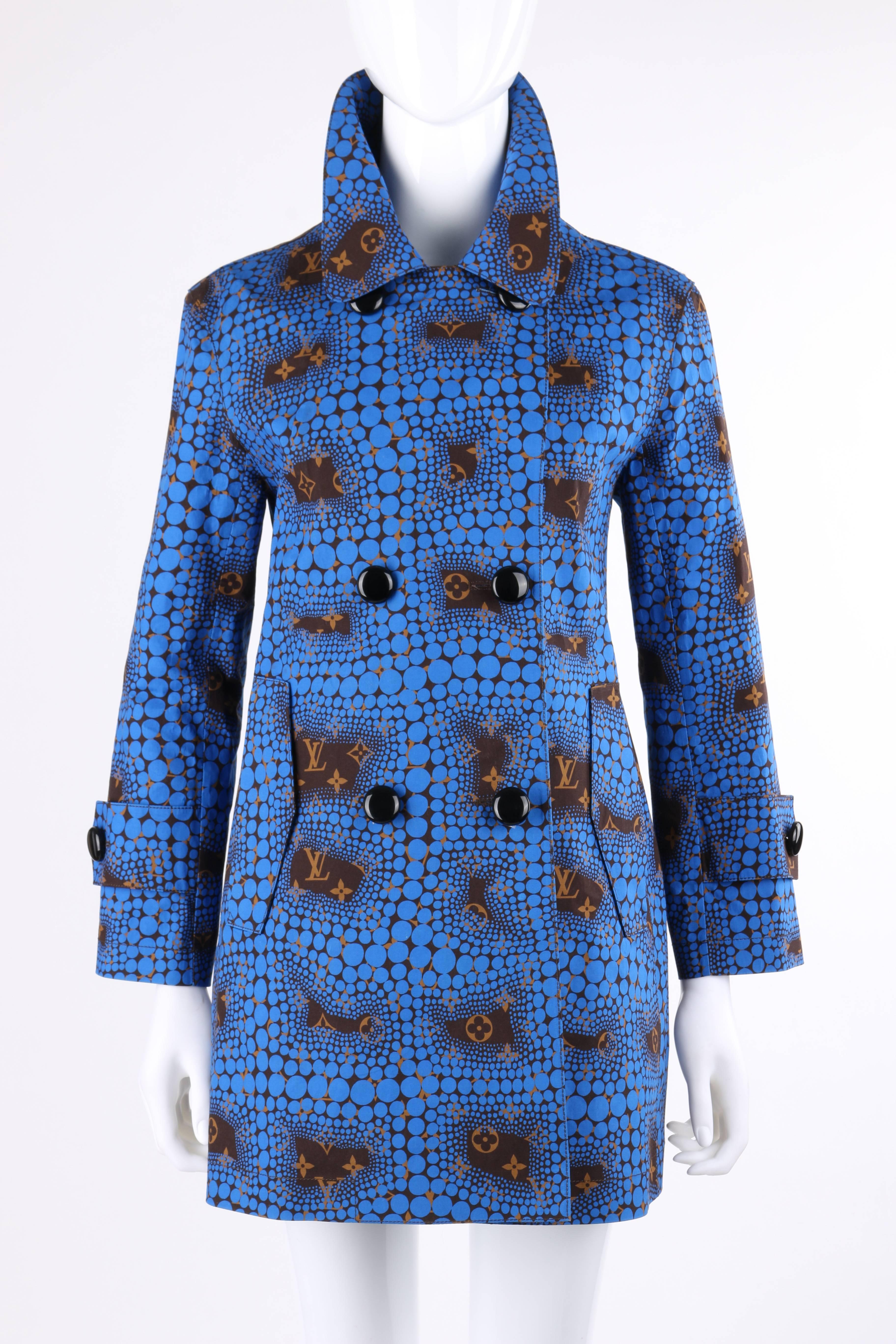 Rare Louis Vuitton Limited Edition c.2012 blue "monogram town" polka dot trench coat designed as a collaboration by Yayoi Kusama and Marc Jacobs. True blue abstract polka dot over brown signature "LV" monogram print cotton. Long