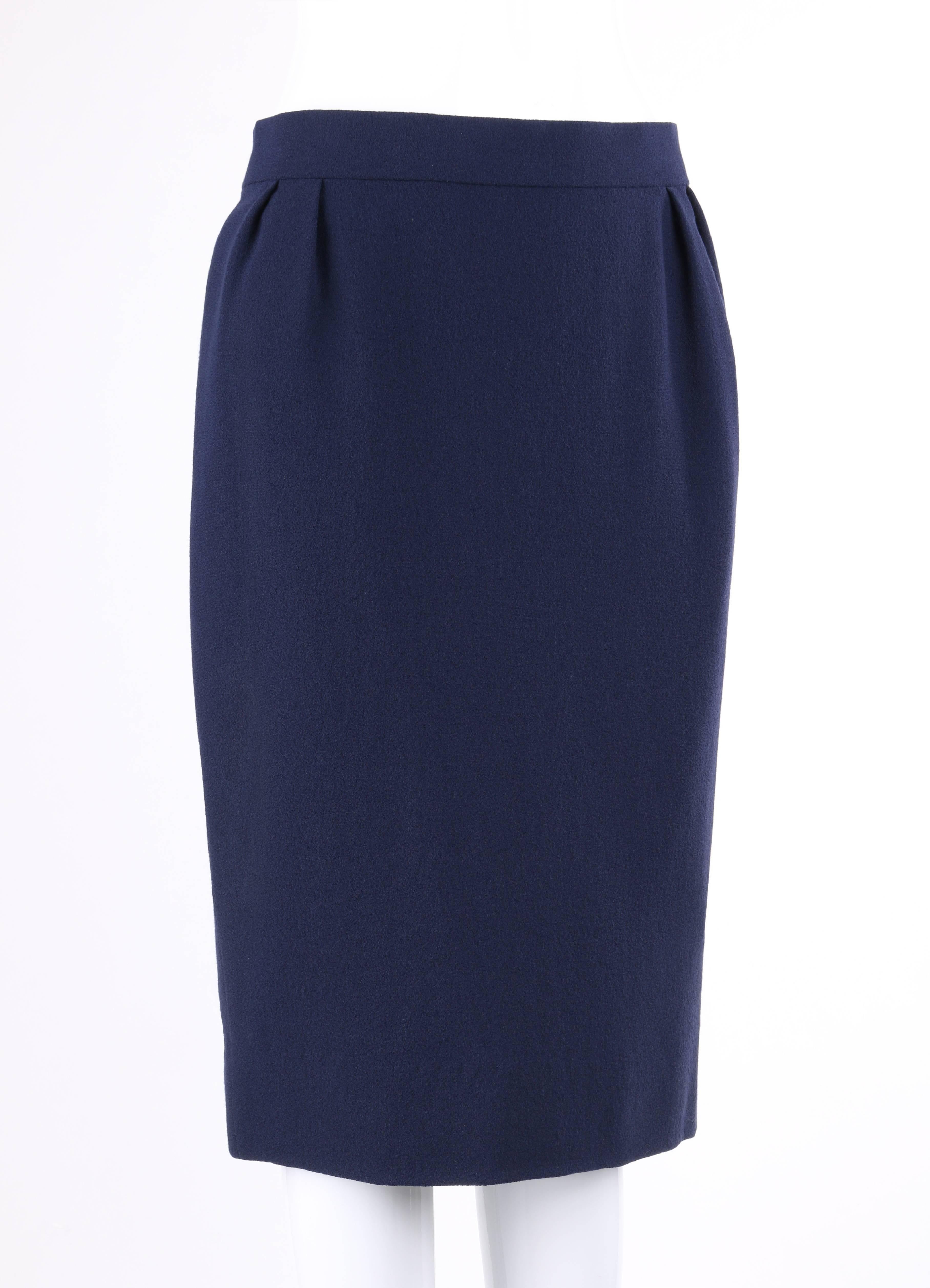 Pierre Cardin Haute Couture c.1990's classic navy blue pencil skirt. Banded waistline with four front and back knife pleats. Center back invisible zipper with two hook and eye closures at top. Fully lined. Unmarked Fabric Content: Shell: Wool or