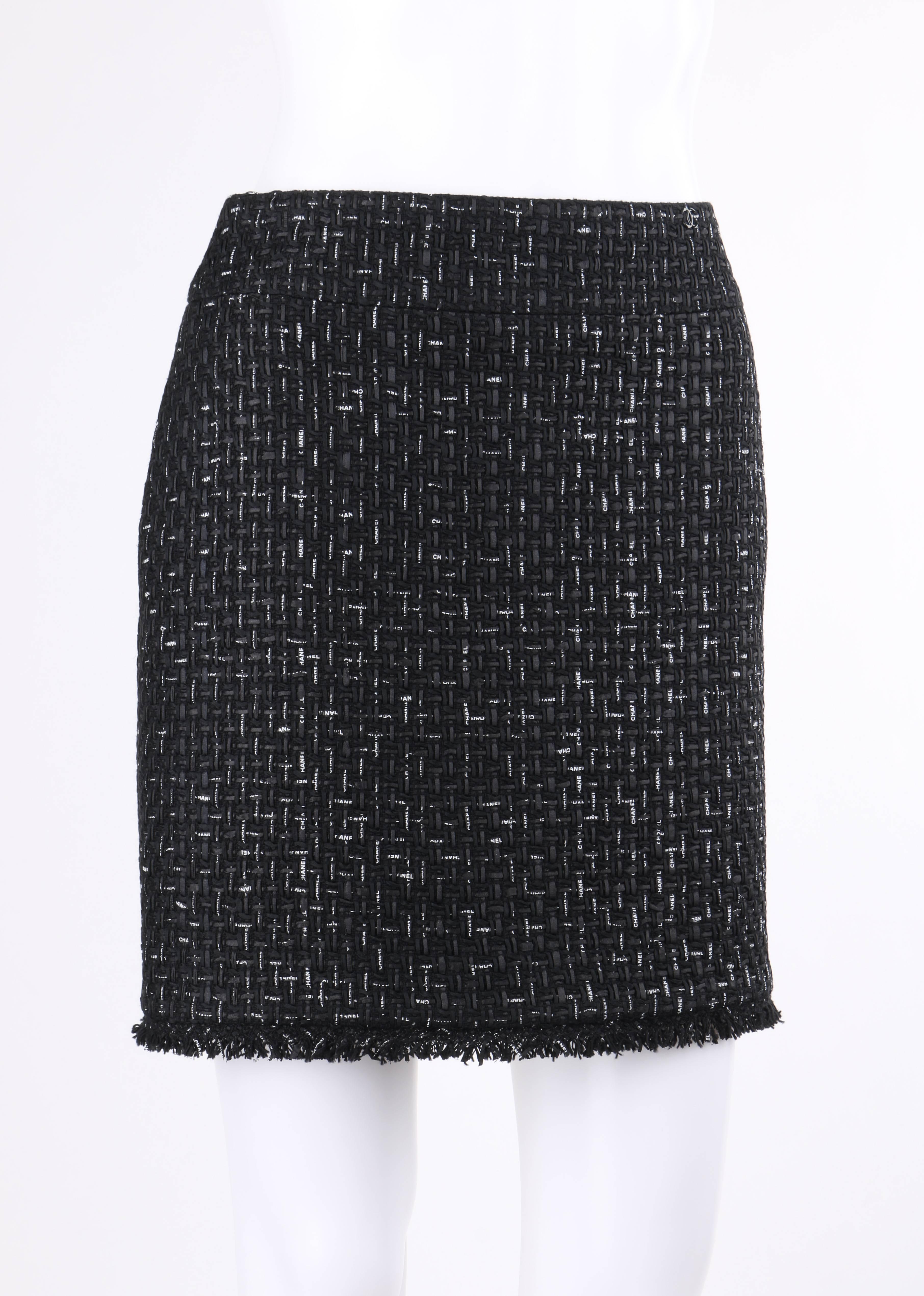 Rare Chanel Cruise 2013 black and white 'Chanel' printed ribbon woven tweed skirt. Same skirt worn by Vogue Australia's senior fashion editor, Christine Centenera, during Paris fashion week. Black tweed with interwoven 'Chanel' logo grosgrain