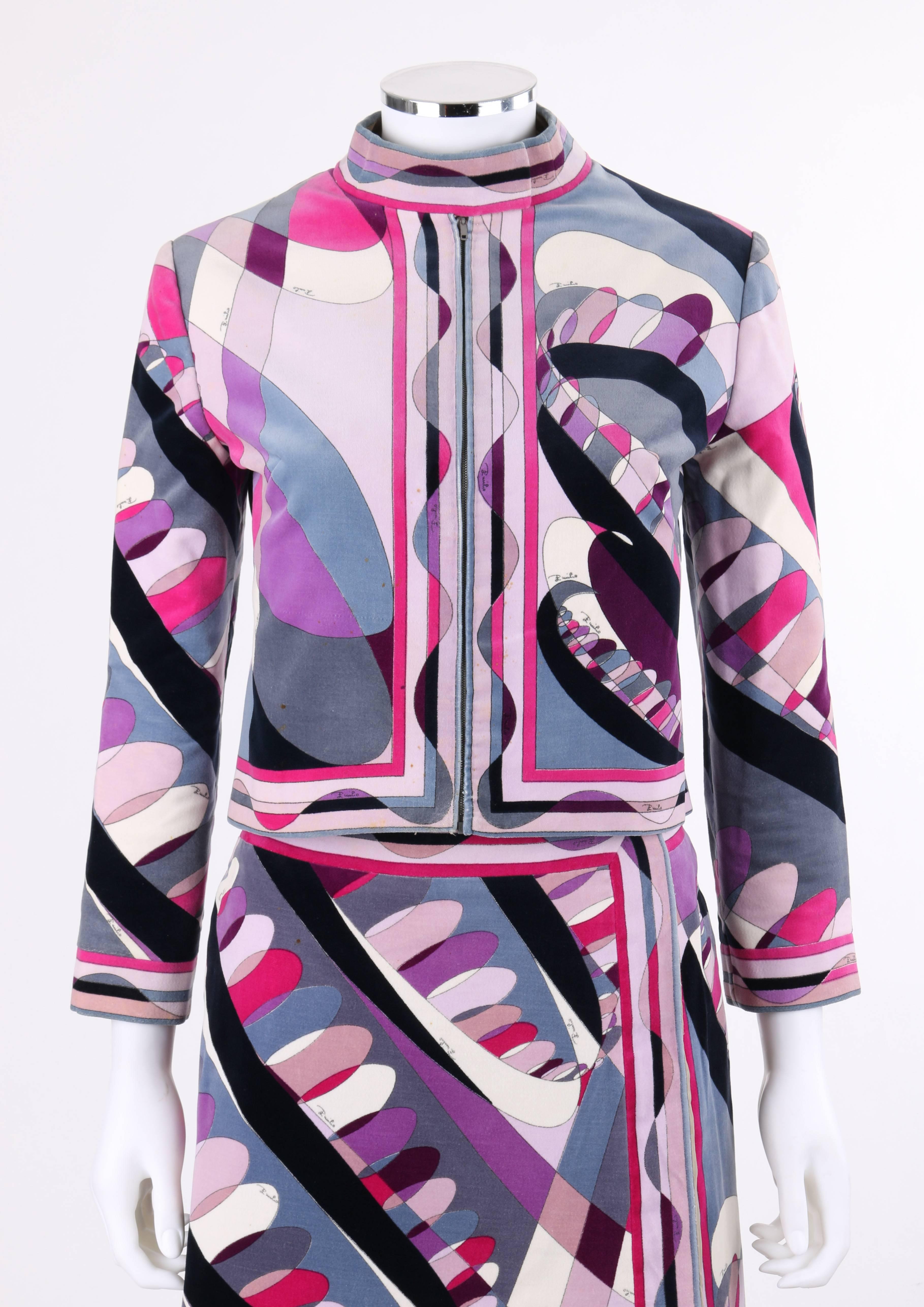 Vintage Emilio Pucci c.1960's two-piece purple signature op art print velvet jacket and skirt suit set exclusively for Saks Fifth Avenue. Multicolor op art print cotton velvet in shades of purple, fuchsia, gray, black, and white with striped border