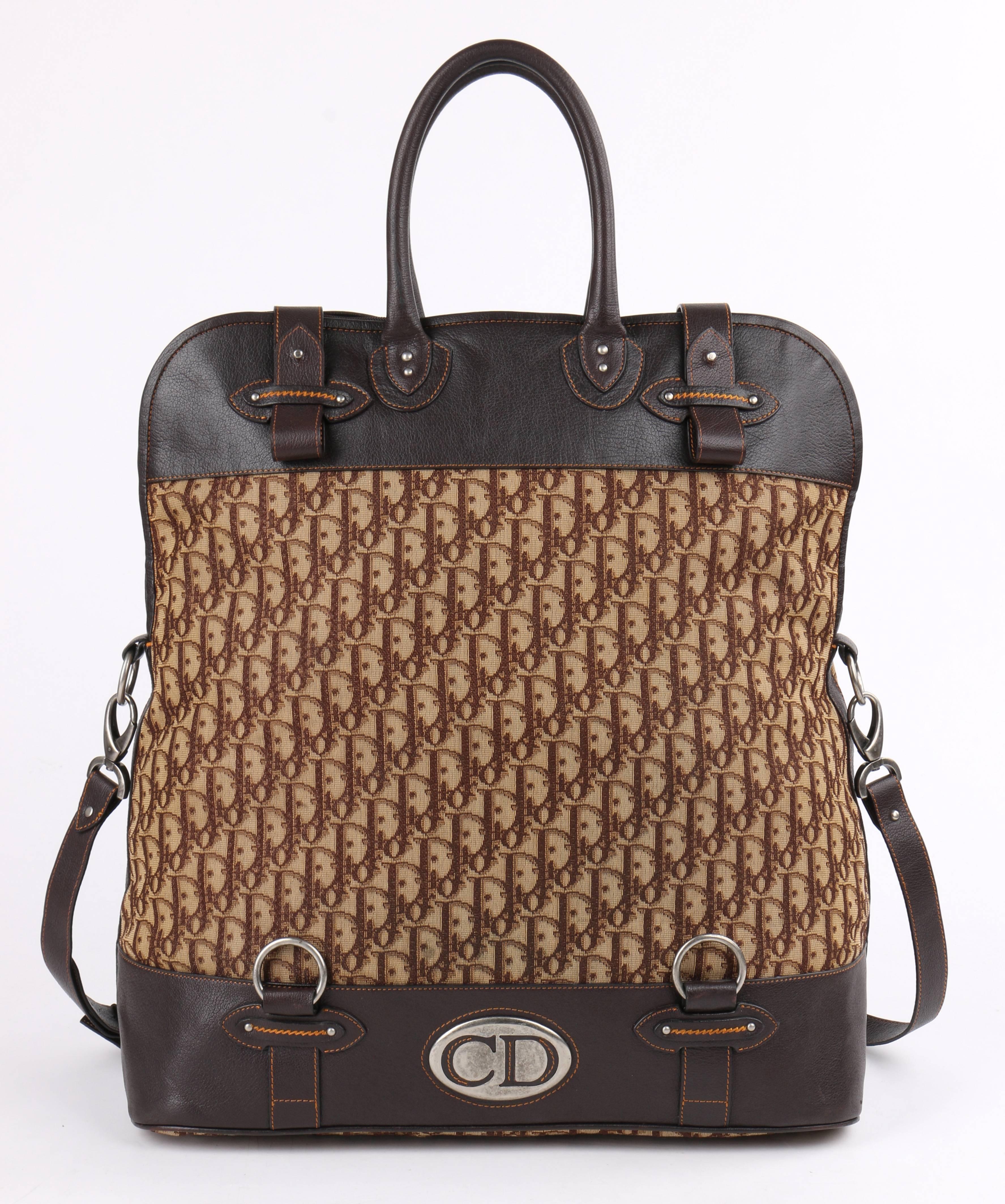 Christian Dior brown Diorissimo monogram canvas and dark brown leather fold-over travel bag. Two single rolled top leather handles. Tan and brown 