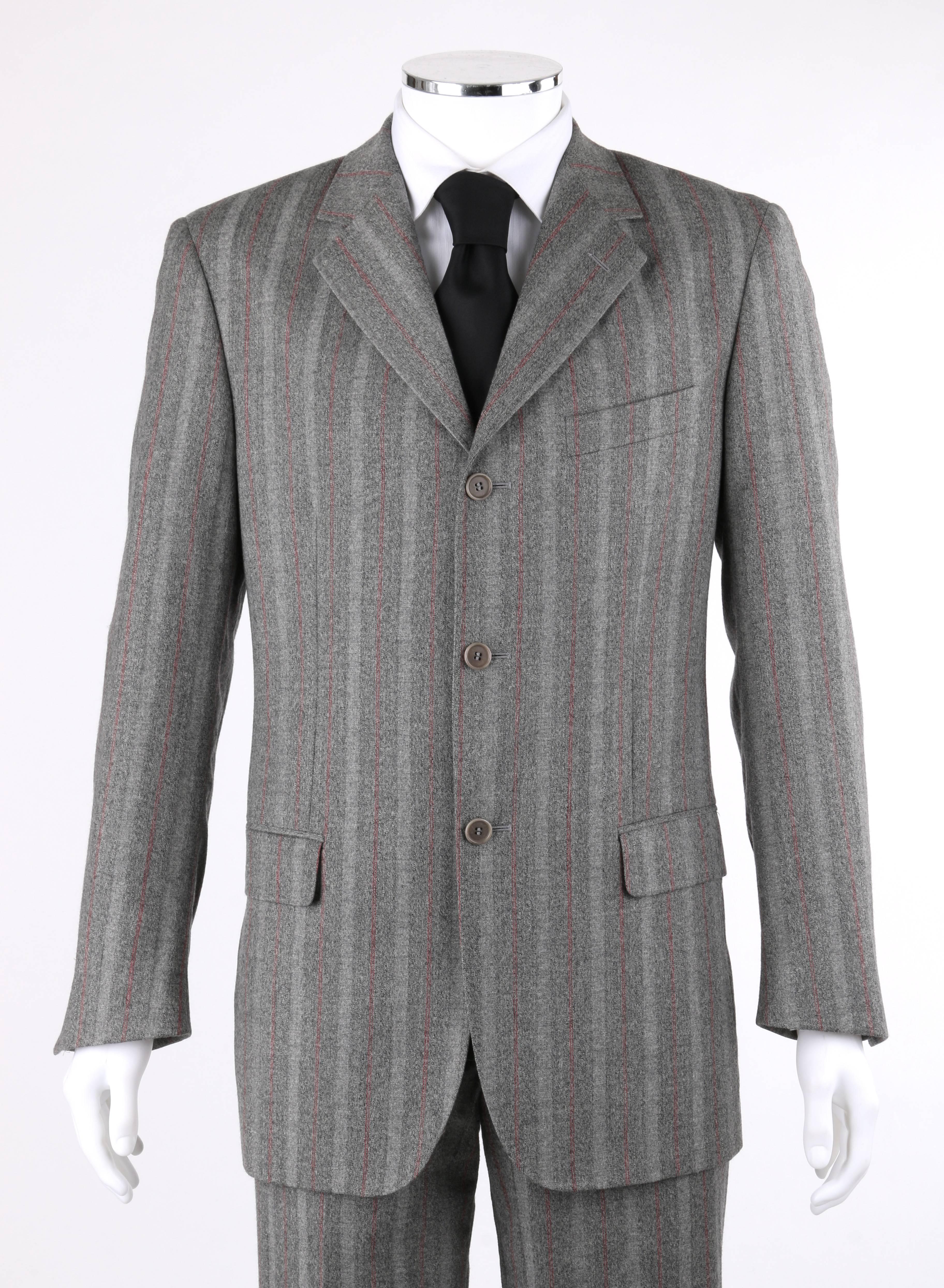 Alexander McQueen c.2001 two-piece gray and red pinstripe pantsuit. Double row red pinstripe on gray super 150 wool. Notched lapel collar jacket with buttonhole detail on lapel. Three center front button closures. Long sleeves with four-button
