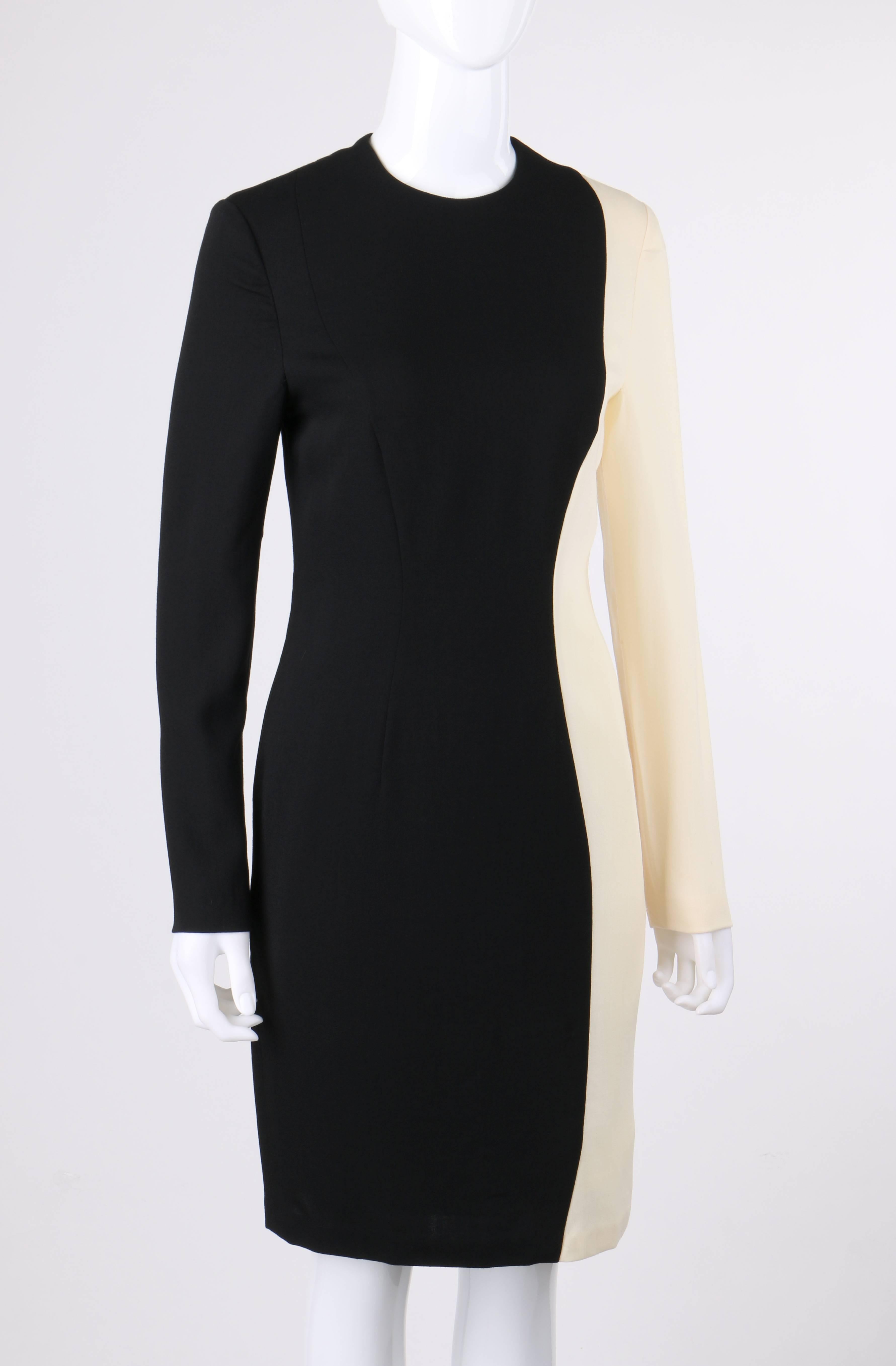 Vintage Pierre Cardin c.1980's black and ivory color-block wool cocktail dress. Long sleeve shift style. Crew neckline. Stylized curved princess seams. Center back zipper closure. Center back slit. Partially lined. Marked Fabric Content: 