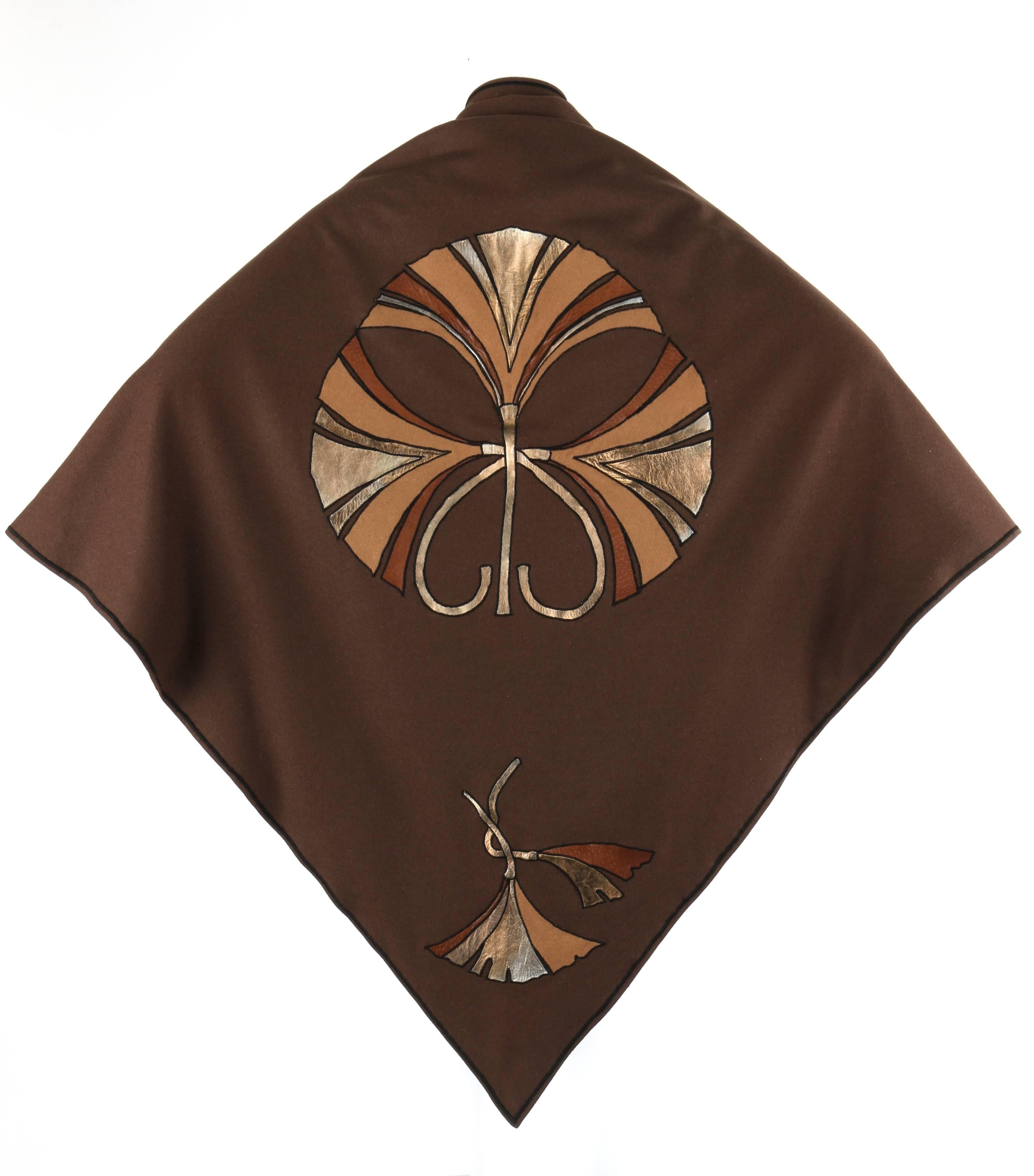 RARE Vintage Christian Dior c.1970's brown wool and leather fan art nouveau applique shawl/cape. Large triangular shape. Open front wrap style. Fan applique at center back and each corner in brown, metallic gold, and silver leather and wool. Thin