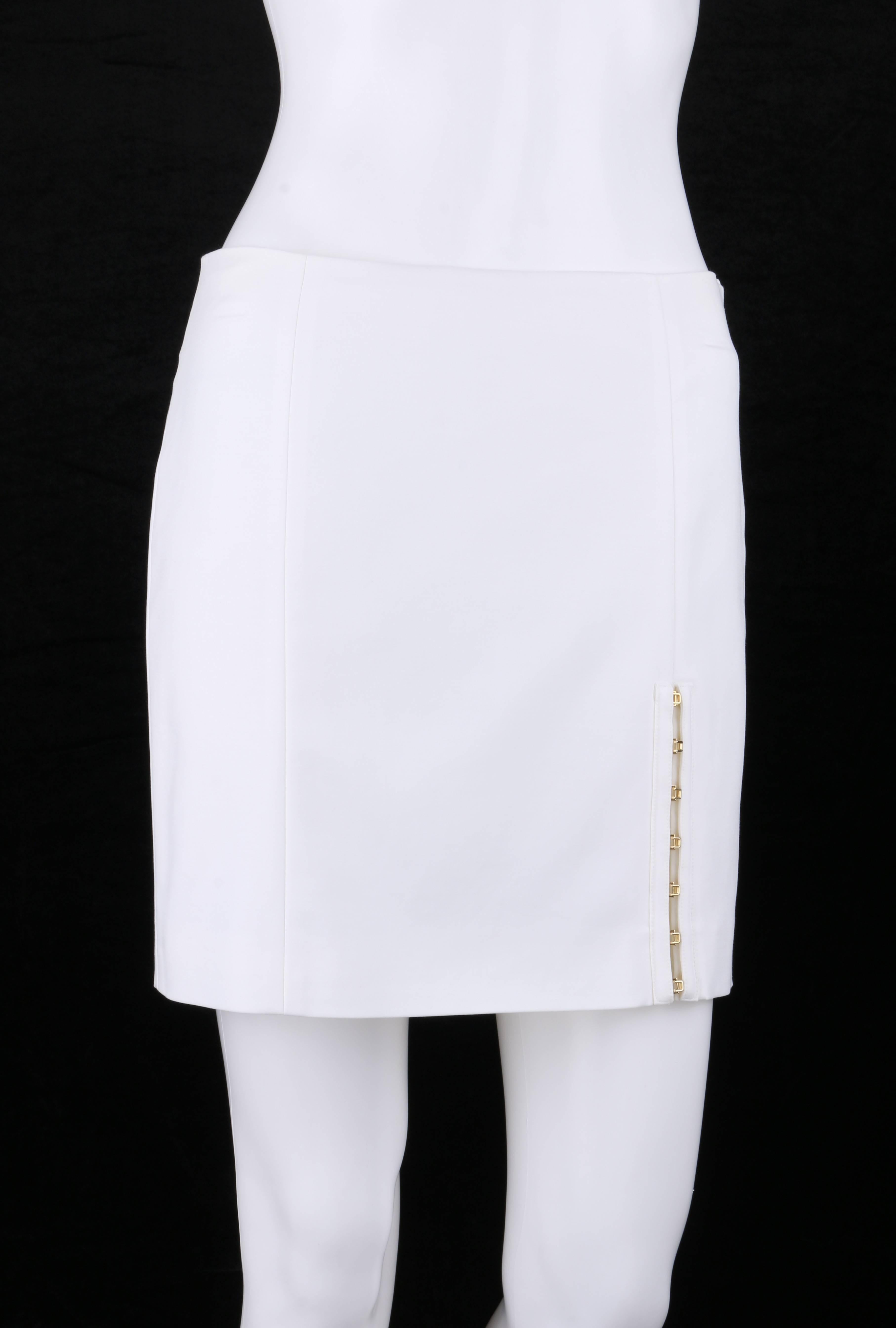 Versace Spring/Summer 2011 white stretch cotton gold hook detail mini skirt; New with tags. Six panel mini skirt. Front side seam slit with seven gold-toned hook and eye closures. Left side seam invisible zipper with hook and loop closure at top.