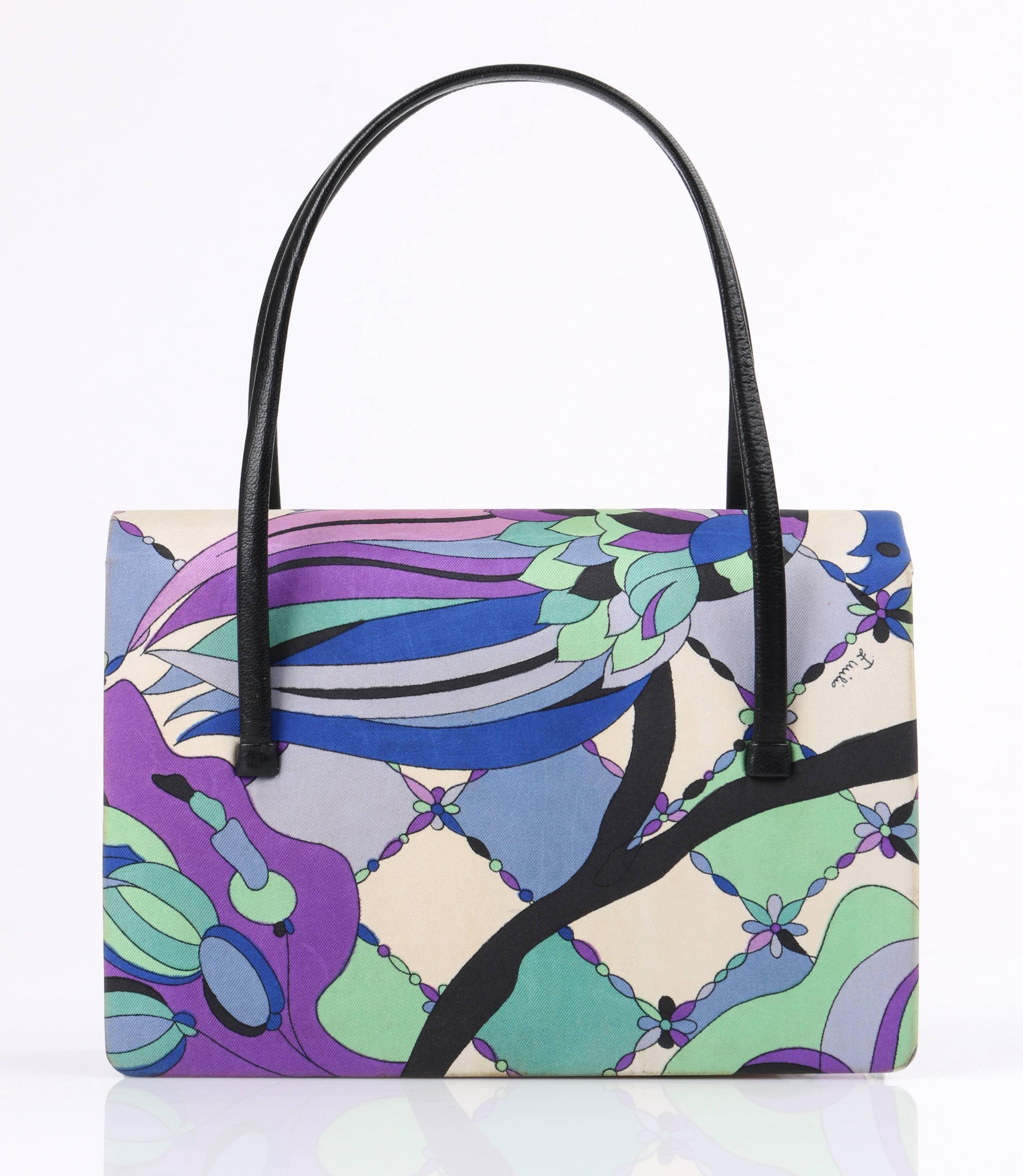 Vintage Emilio Pucci c.1960's blue multicolor signature botanical print silk handbag. Signature silk botanical and bird print silk in shades of purple, white, blue, black, and green. Two thin black leather top handles. Tiered flap top with single