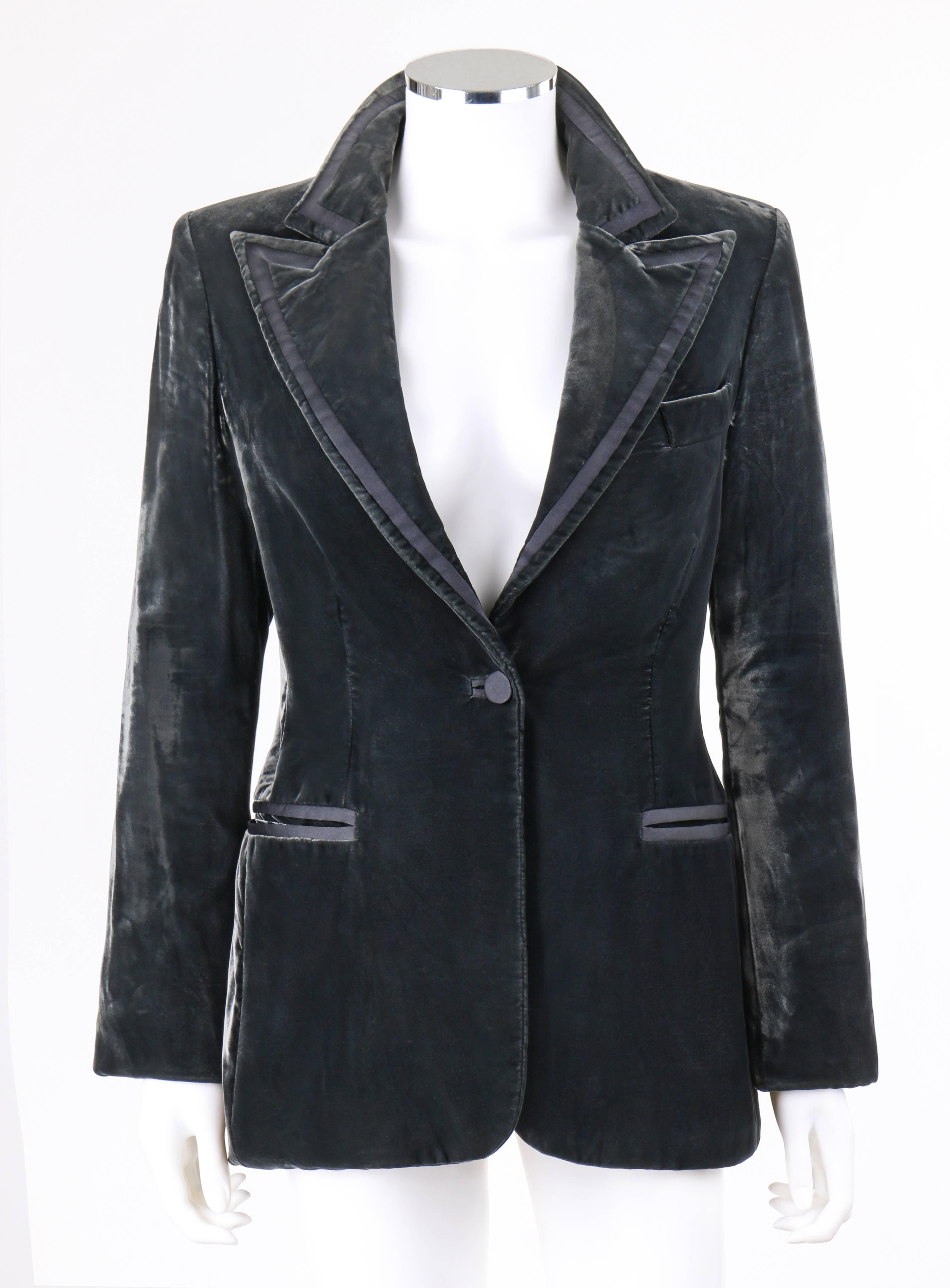 Gucci Autumn/Winter 2004 charcoal gray velvet single button blazer designed by Tom Ford. Peak lapel collar with thin satin stripe detail. Long sleeves with four covered button detail. Single center front satin covered button closure. Two front
