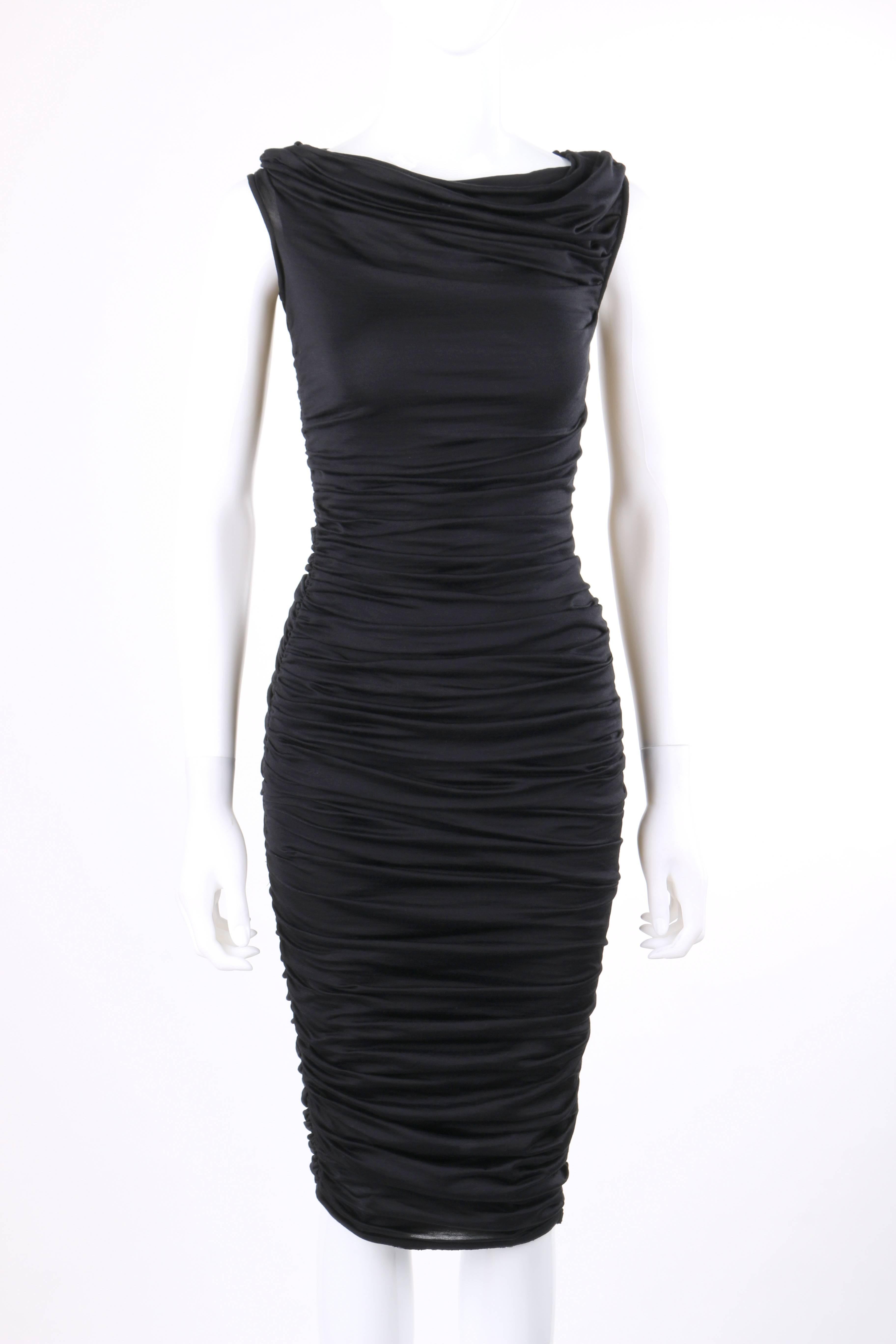 Giambattista Valli black silk jersey knit ruched bodycon cocktail dress. Asymmetrical cowl neckline with ruched detail at right shoulder seam. Sleeveless. Thin rib knit detail at armholes. Ruched detail along both side seams from under arm to hem.