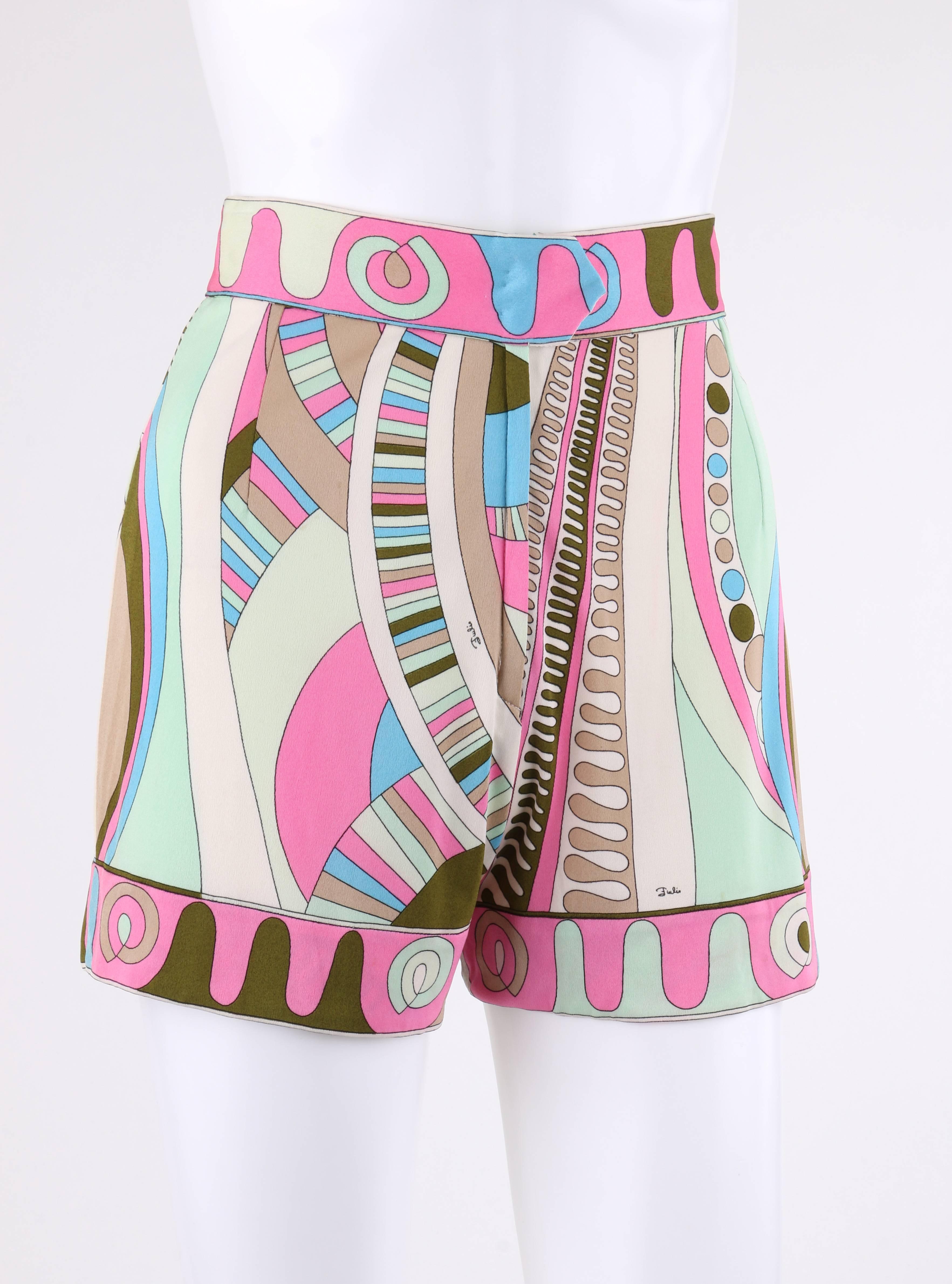 Vintage Emilio Pucci c.1970's pink multicolor signature op art print silk shorts in shades of pink, white, beige, green, and blue. Banded waist. Two front and back waistline darts. Center front zip fly with single snap closure at top. High waisted