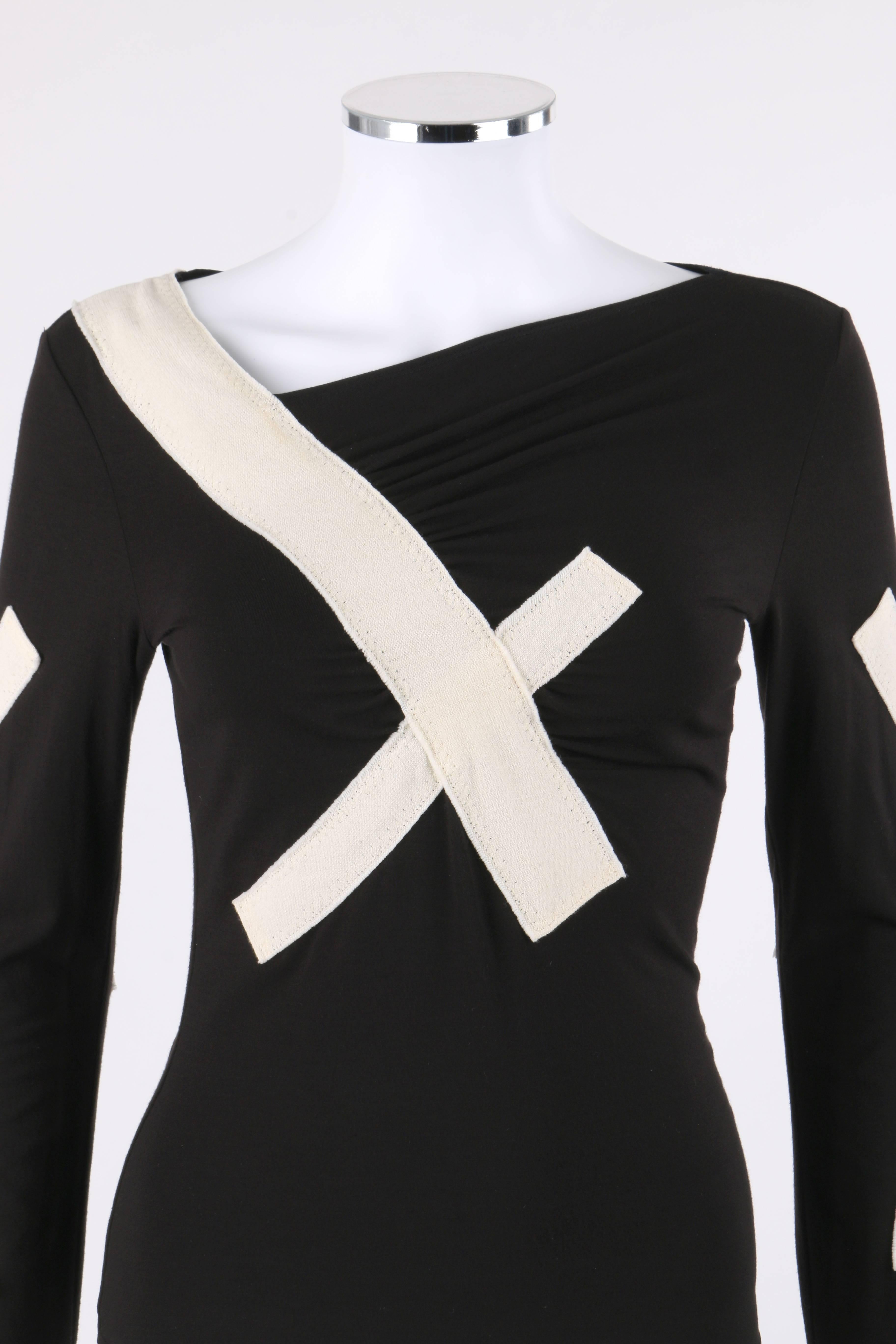 Issey Miyake Spring/Summer 2004 black jersey knit & winter white bandage sweater / top. Designed by Naoki Takizawa. Runway look #11. Asymmetrical bateau neckline. Winter white bandage cross detail wrapping from shoulder to center at front and back