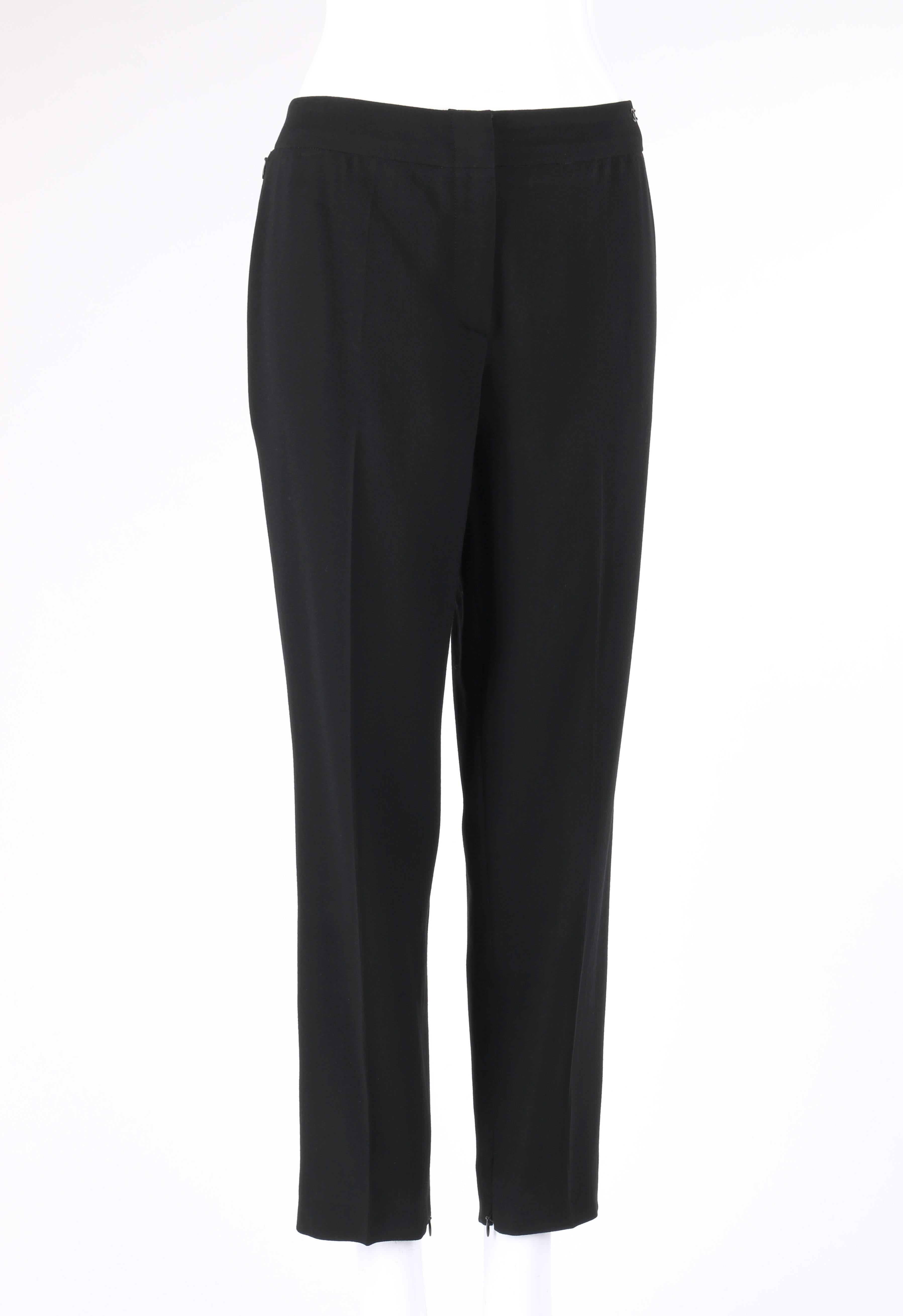 Chanel Spring/Summer 2003 classic black wool slim cut cropped pants / trousers. Designed by Karl Lagerfeld. Thin banded waist. Center front zip fly with two hook and bar closures at top. Two side seam invisible zipper closure pockets at hips. Black