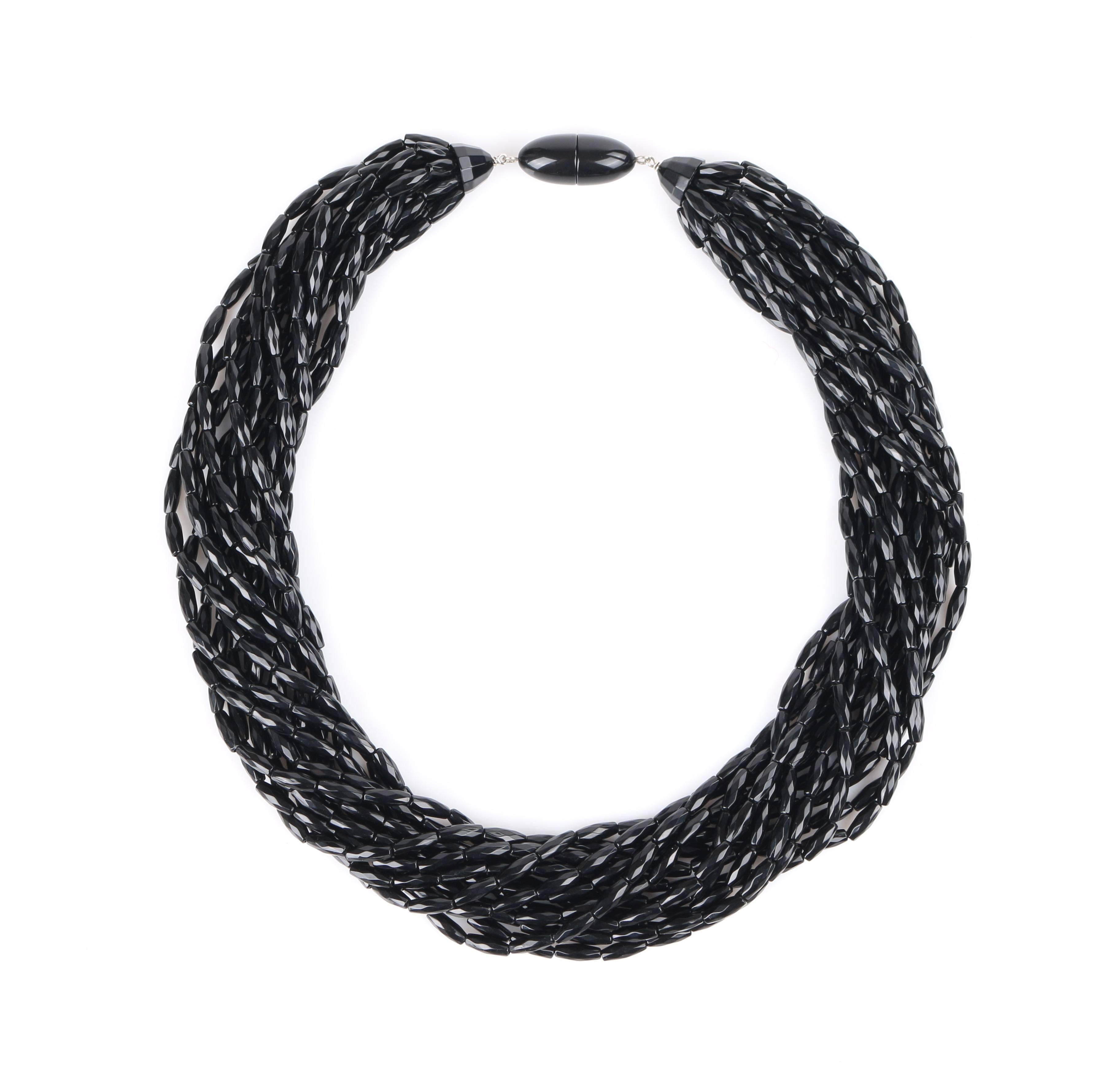 Angela Caputi black multi-strand knotted choker necklace. Thirteen strands made up of black faceted bi-cone resin beads. Each strand is attached to a black faceted semi-sphere with knotted detail at center. Necklace fastens with an oblong snap
