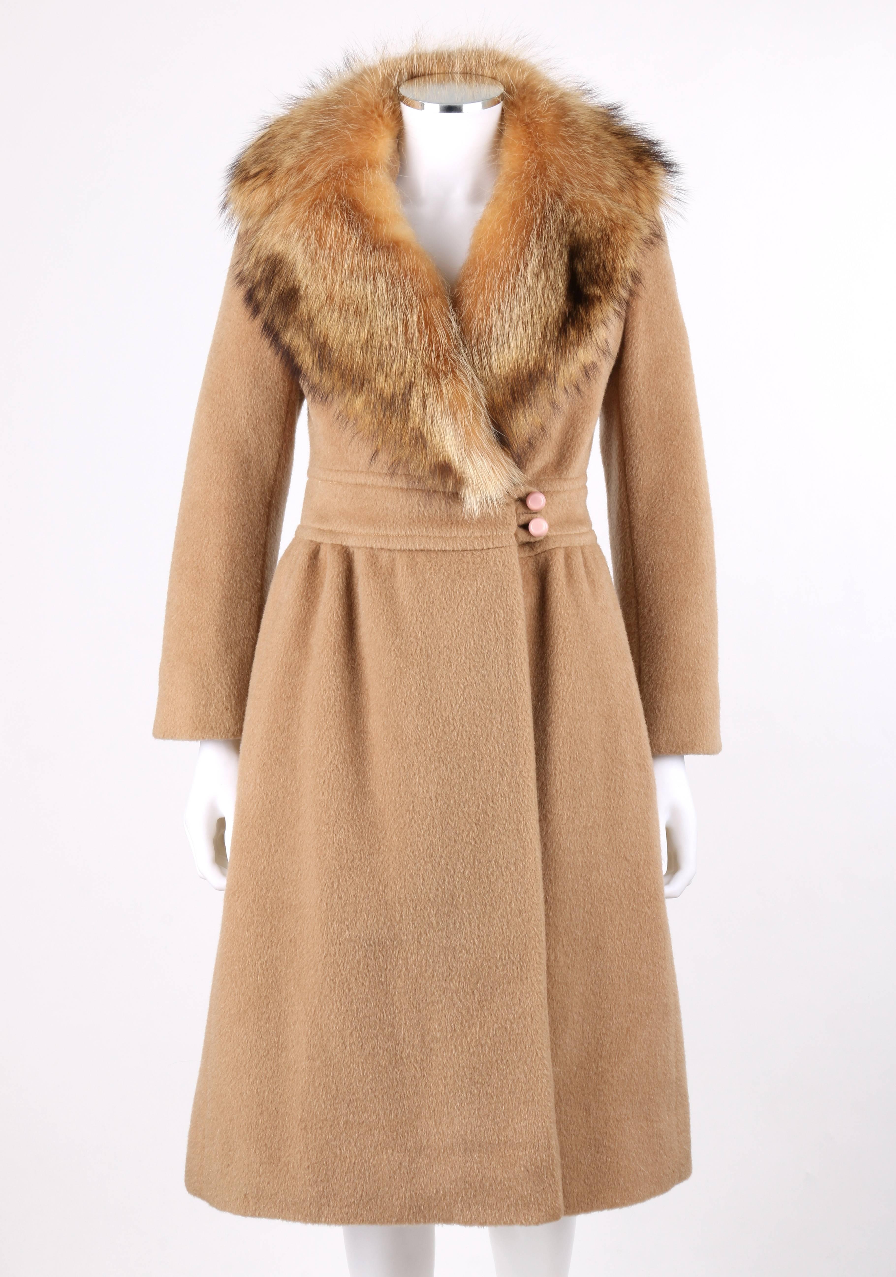 Vintage Pierre Cardin c.1970's camel wool genuine fox fur collar princess coat. Rounded notched lapel fox fur collar. Long sleeves with single button detail and slit at cuff. Princess seams. Banded waist with two button and loop closures at left