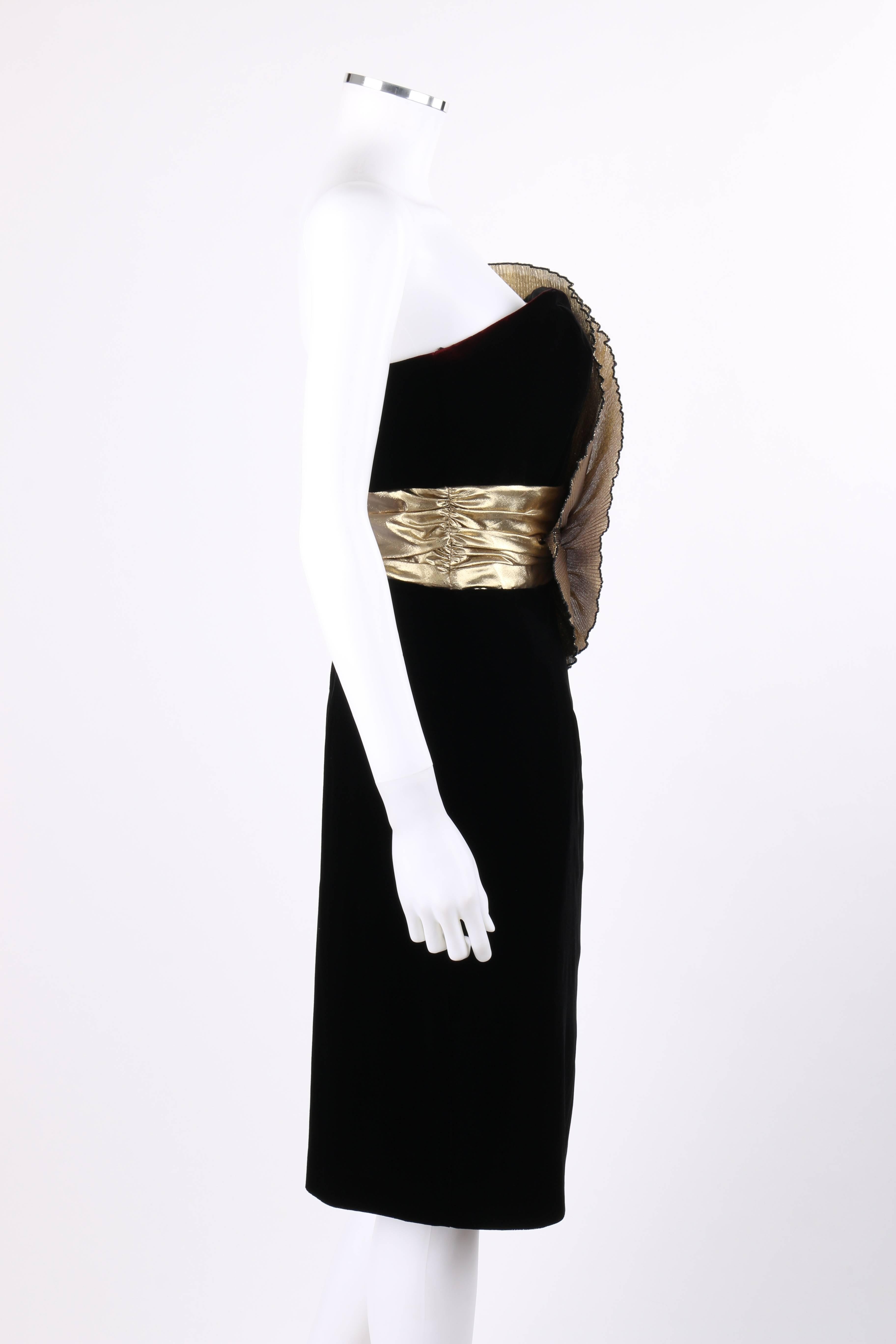 Dave & Johnny by Jroseph Lara c.1980's black velvet and metallic gold lame statement dress. Large gold lame accordion pleated fan gathered with rhinestone crystal embellishment at front waist. Strapless shift style. Sweet heart neckline.