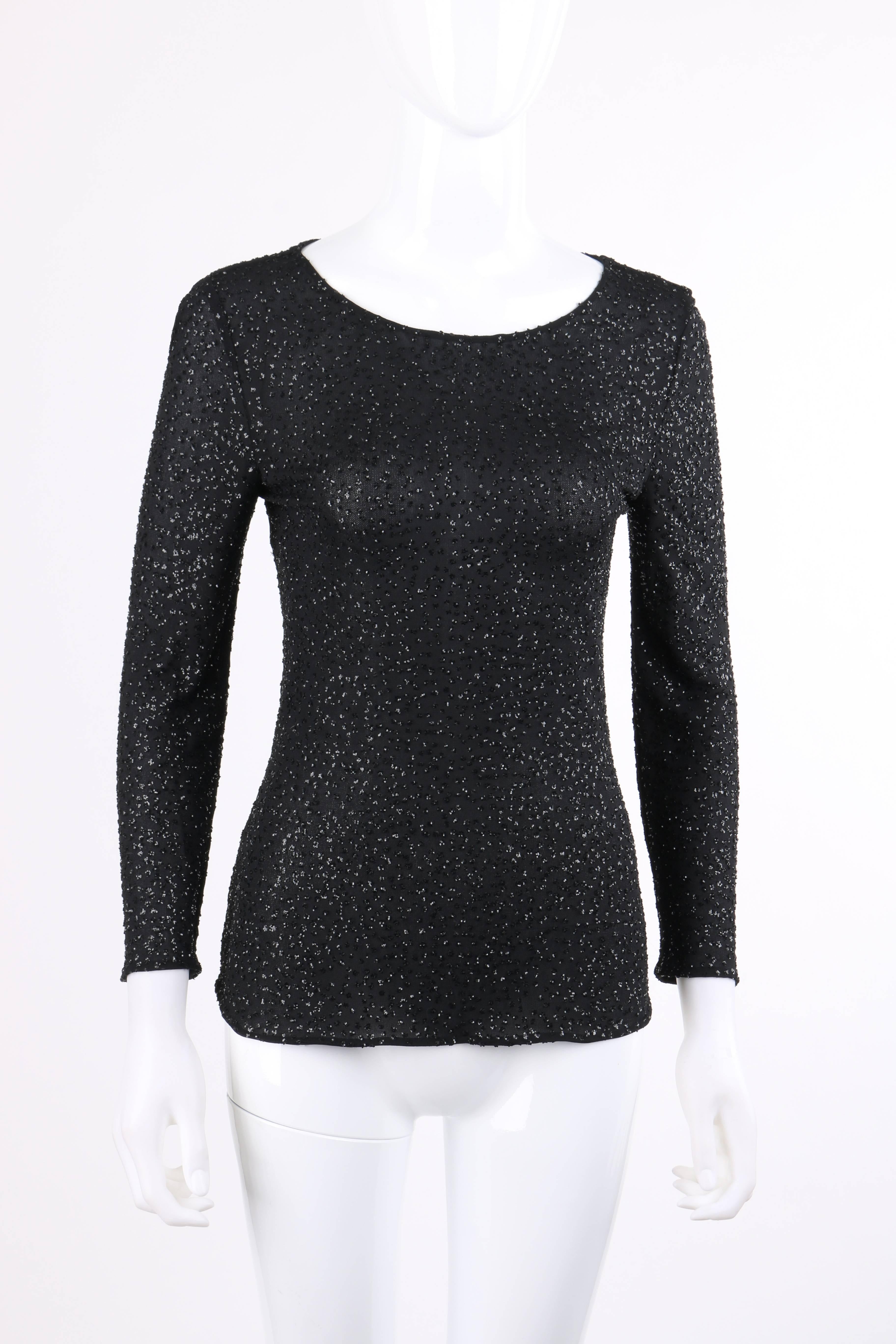 Valentino Boutique Autumn/Winter 2000 black metallic sequin knit scoop neck top designed by Valentino Garavani. Black semi-sheer knit with all over sequin clusters. 3/4 length sleeves. Wide scoop neckline. Center back invisible zipper with hook and
