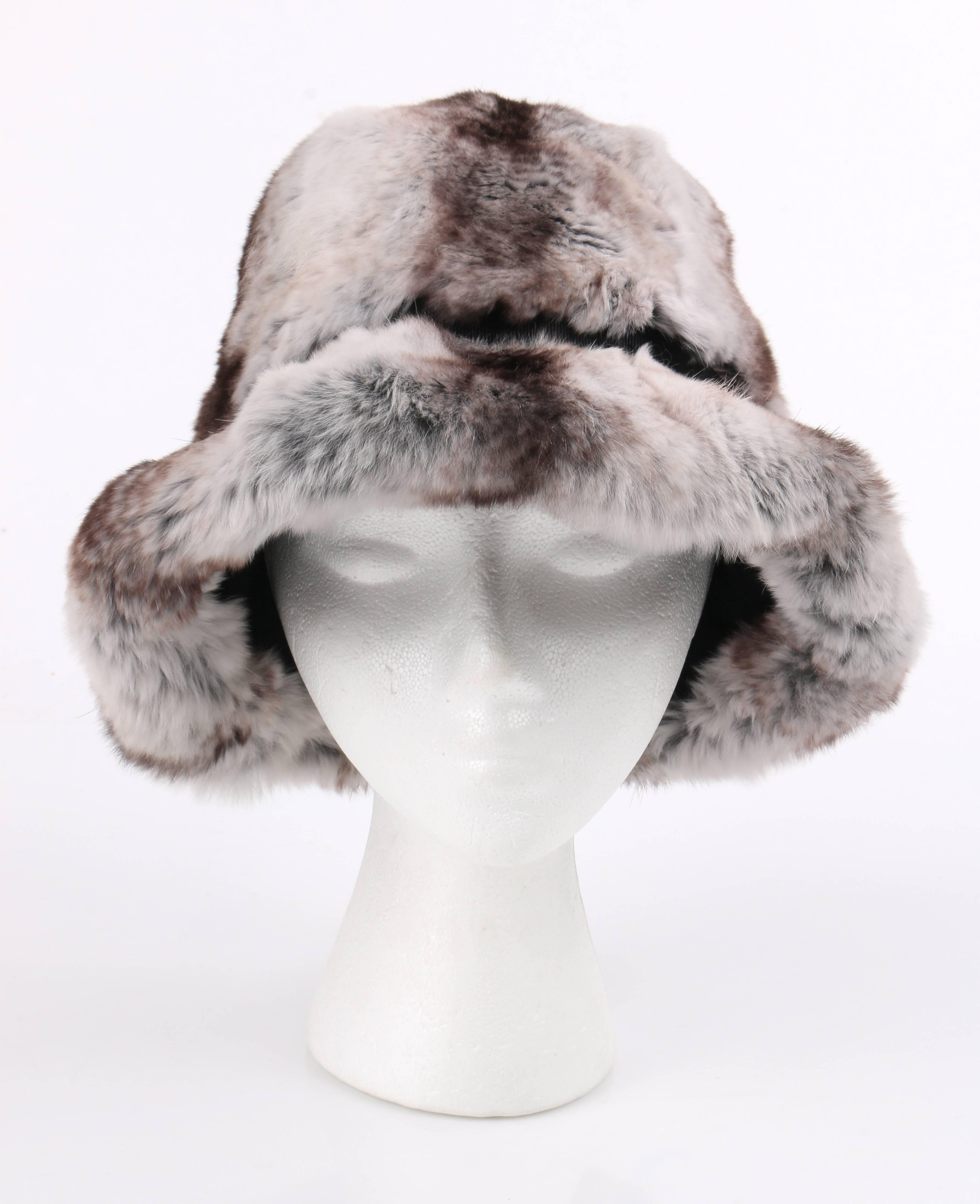 Vintage c.1960's Christian Dior Chapeaux natural gray and brown striped chinchilla fur cloche hat. Designed by Marc Bohan. Bell shaped body. Flat turned down brim. Black grosgrain ribbon hat band with wool bow at right. Black wool lining. Black