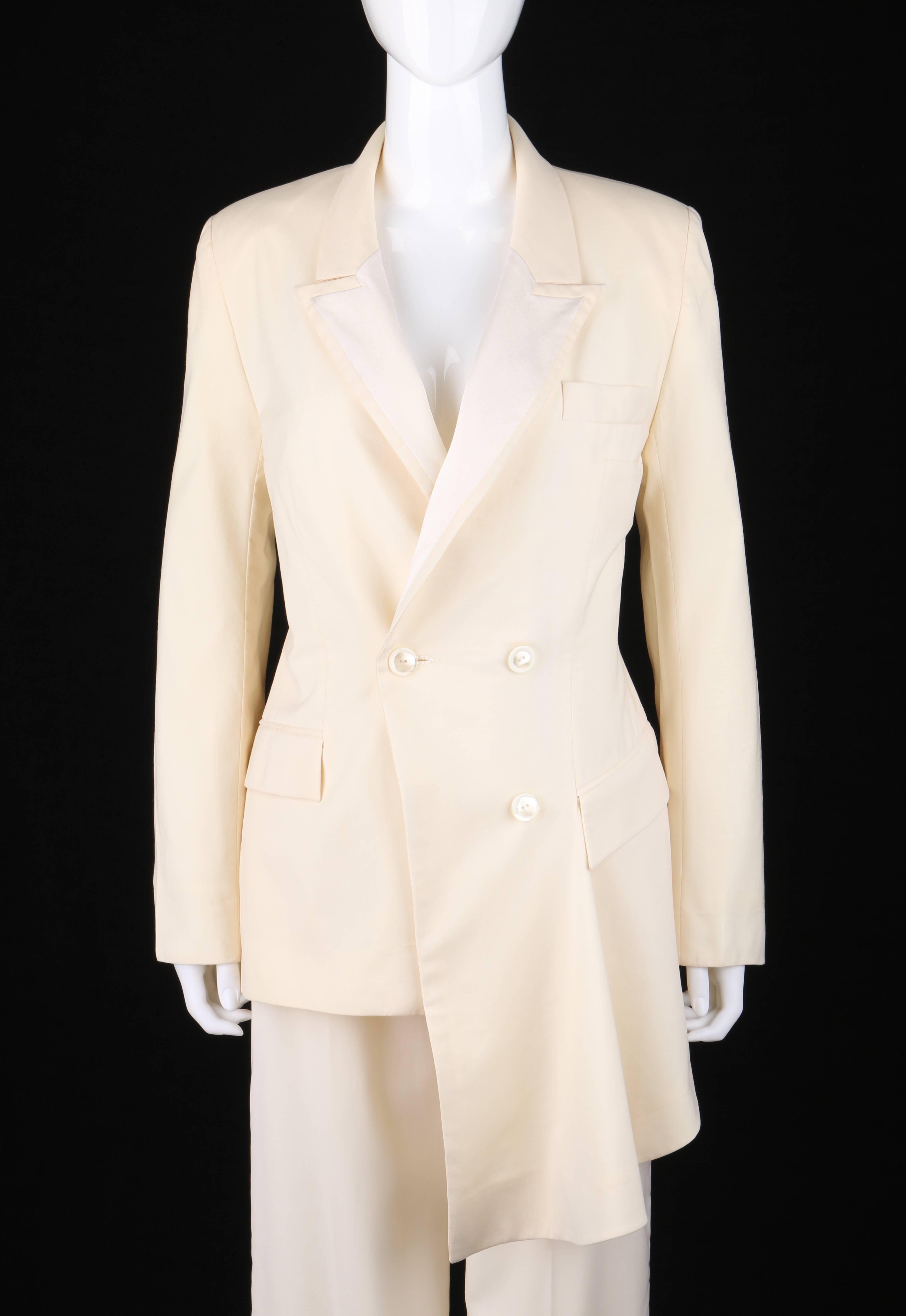 Givenchy Couture Spring/Summer 1999 two piece ivory asymmetrical tuxedo jacket pant suit set designed by Alexander McQueen. Runway look #1. Ivory wool asymmetrical hem jacket. Peak lapel collar with contrasting winter white silk satin detail. Double