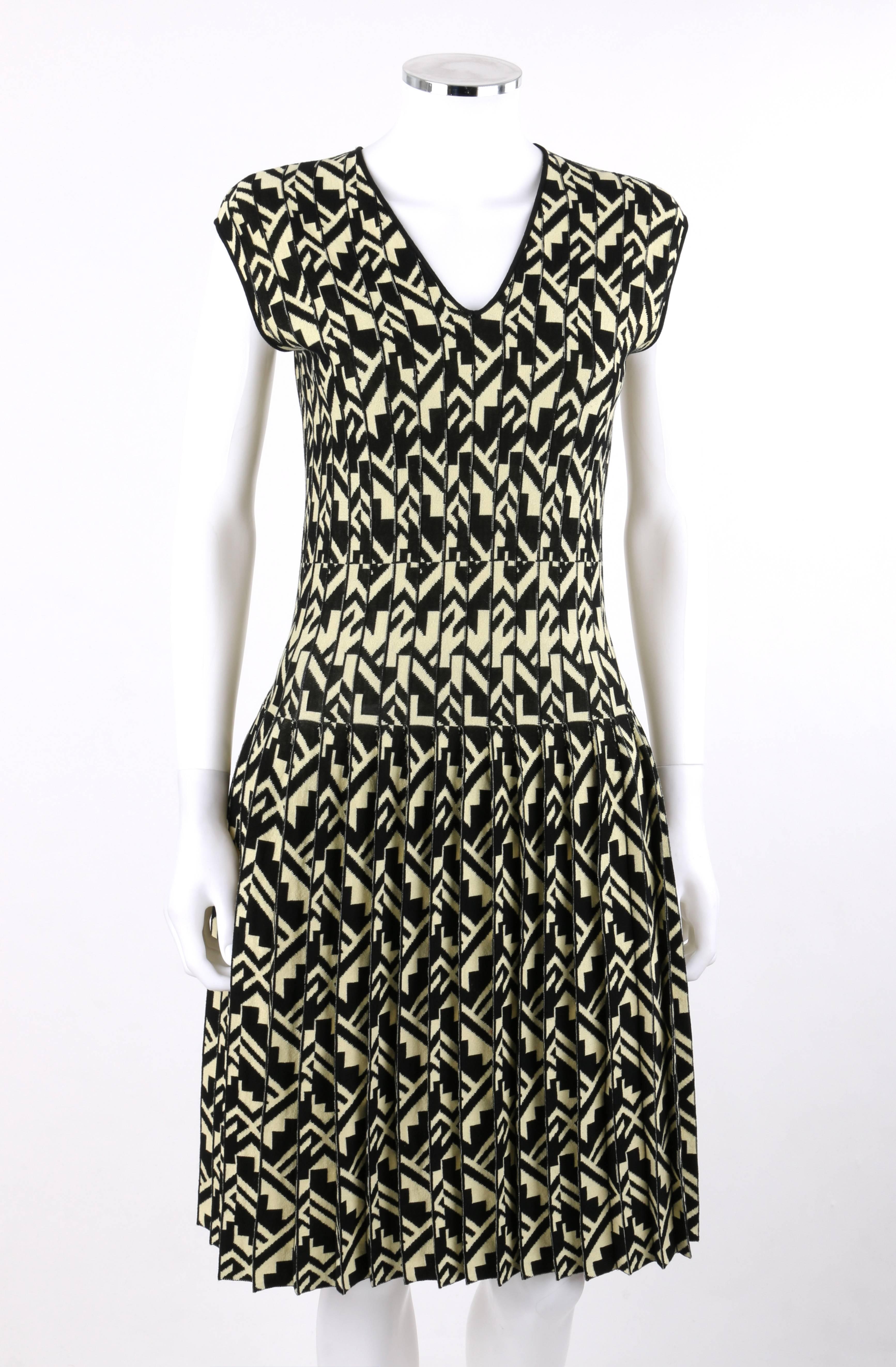 Etro Milano black and soft yellow geometric print knit drop waist pleated cocktail dress; new with tags. V neckline. Sleeveless. Drop waist. Knife pleated skirt. Slip-on style. Thin black rib knit detail at neckline and arm holes. Unlined. MSRP
