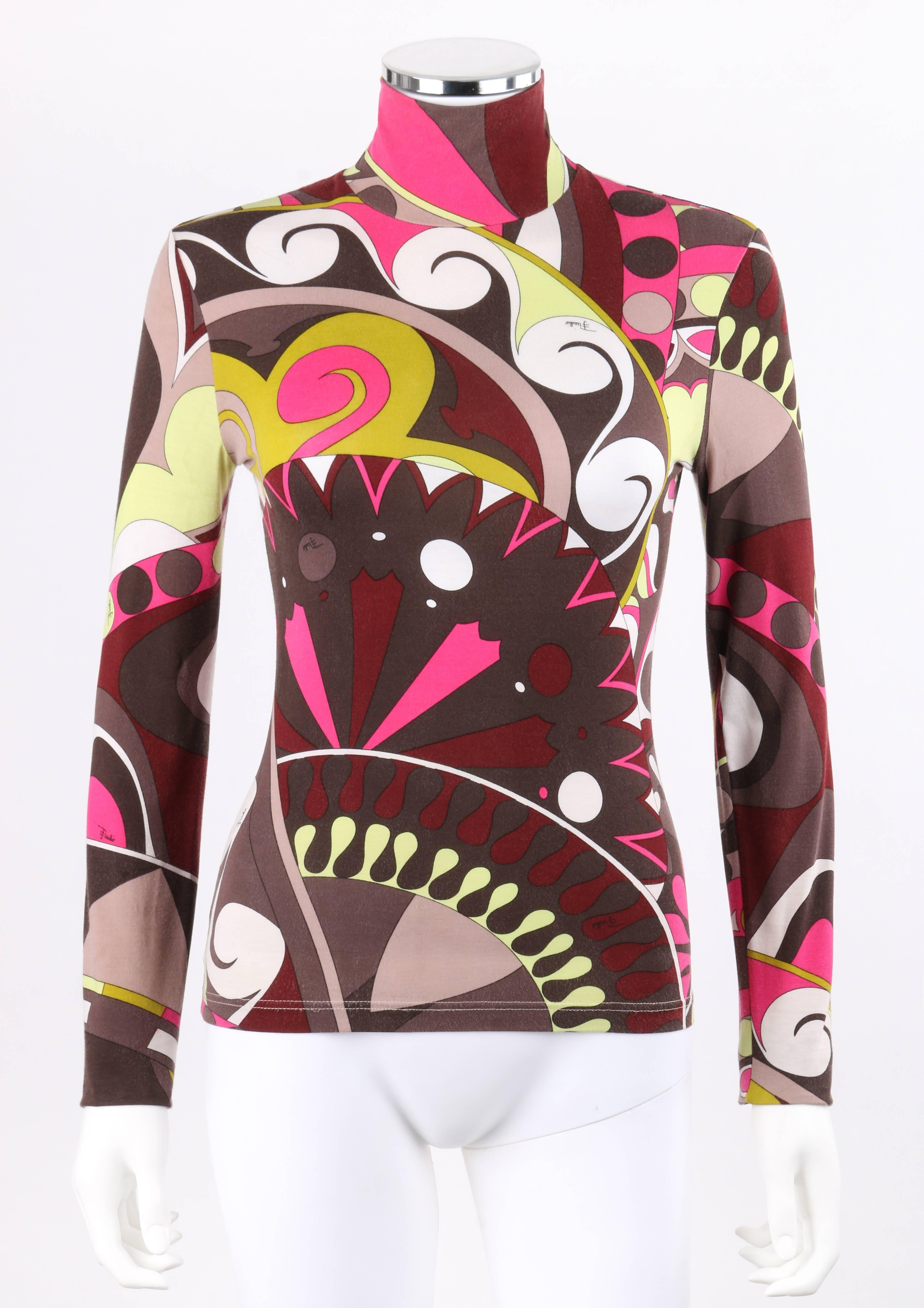 Emilio Pucci brown multi-color op art signature print jersey knit turtleneck top. Large multi-color op art signature print jersey knit in shades of brown, yellow, gray, pink, and white. Turtleneck collar. Long sleeves. Slip-on style. Unlined. Marked