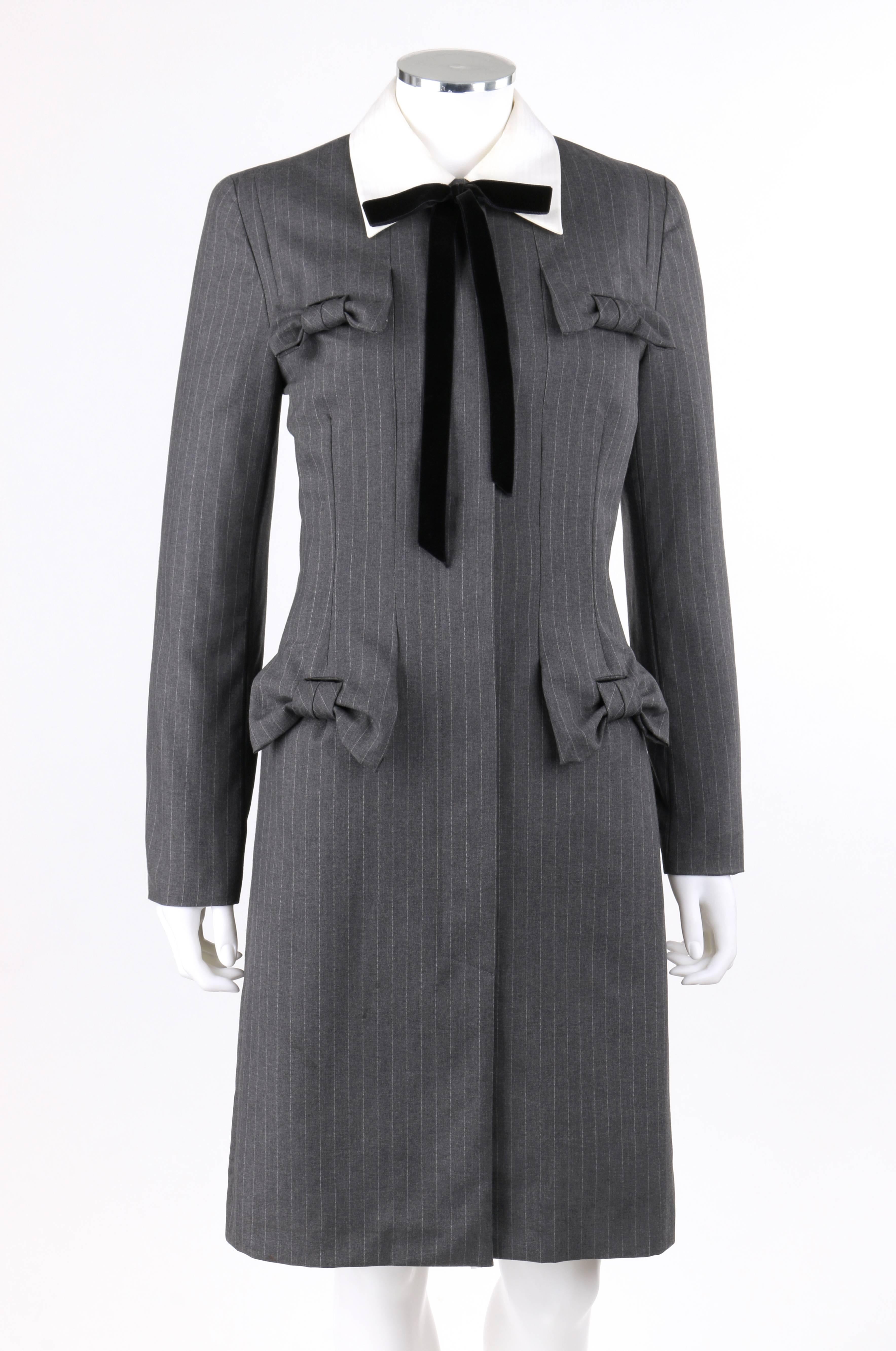 Givenchy Couture Autumn / Winter 1996 charcoal gray wool bow shirt / coat dress. Runway look designed by John Galliano. Charcoal gray pinstripe wool. White pinstripe detachable shirt collar with seven button closures. Black velvet ribbon bow at