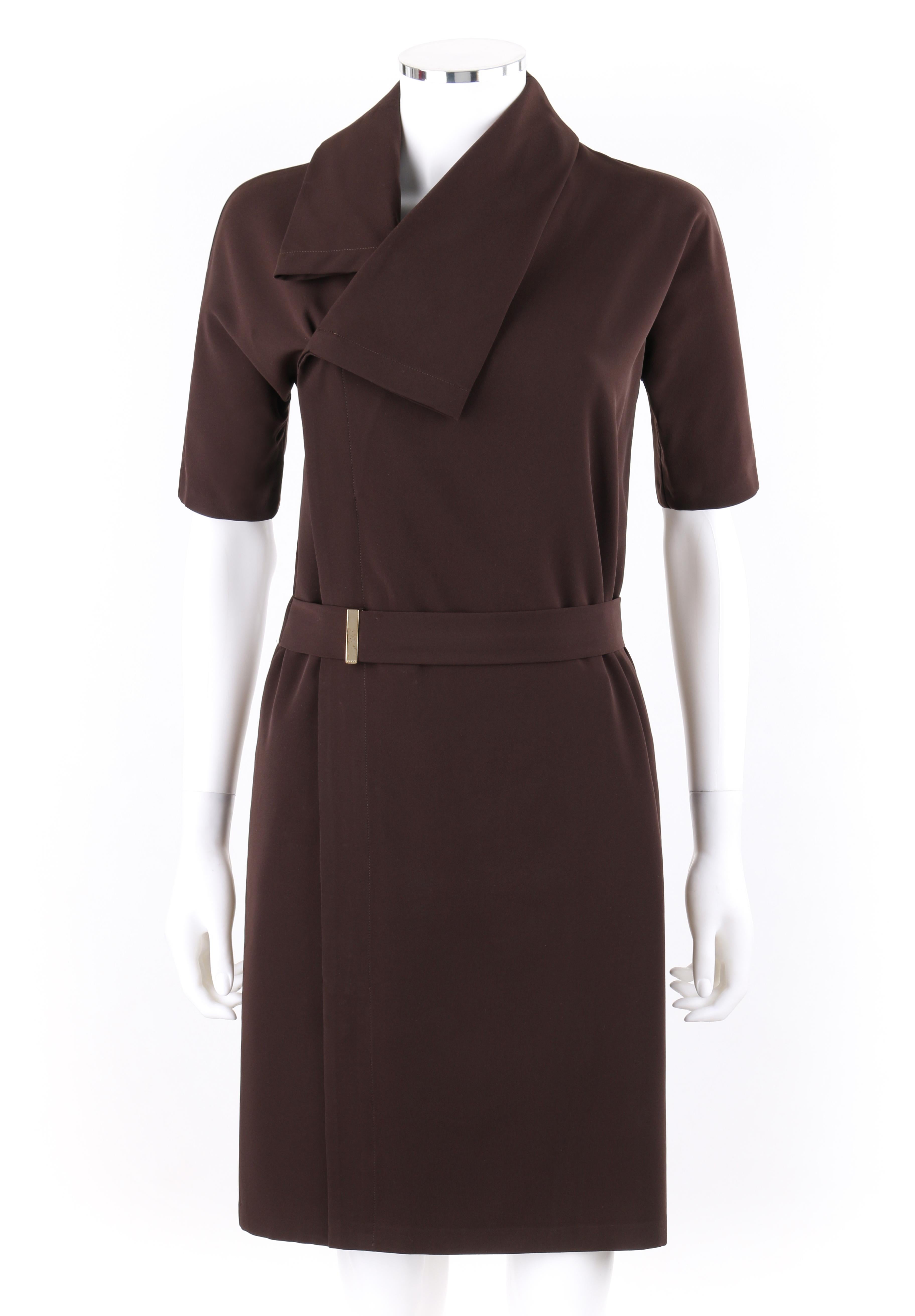 DESCRIPTION: GUCCI A/W 2010 Brown Dolman Sleeve Belted Asymmetrical Shift Cocktail Dress
 
Brand / Manufacturer: Gucci
Designer: Frida Giannini
Style: Asymmetrical shift dress
Color(s): Brown
Lined: No
Marked Fabric Content: 89% Polyester, 11%