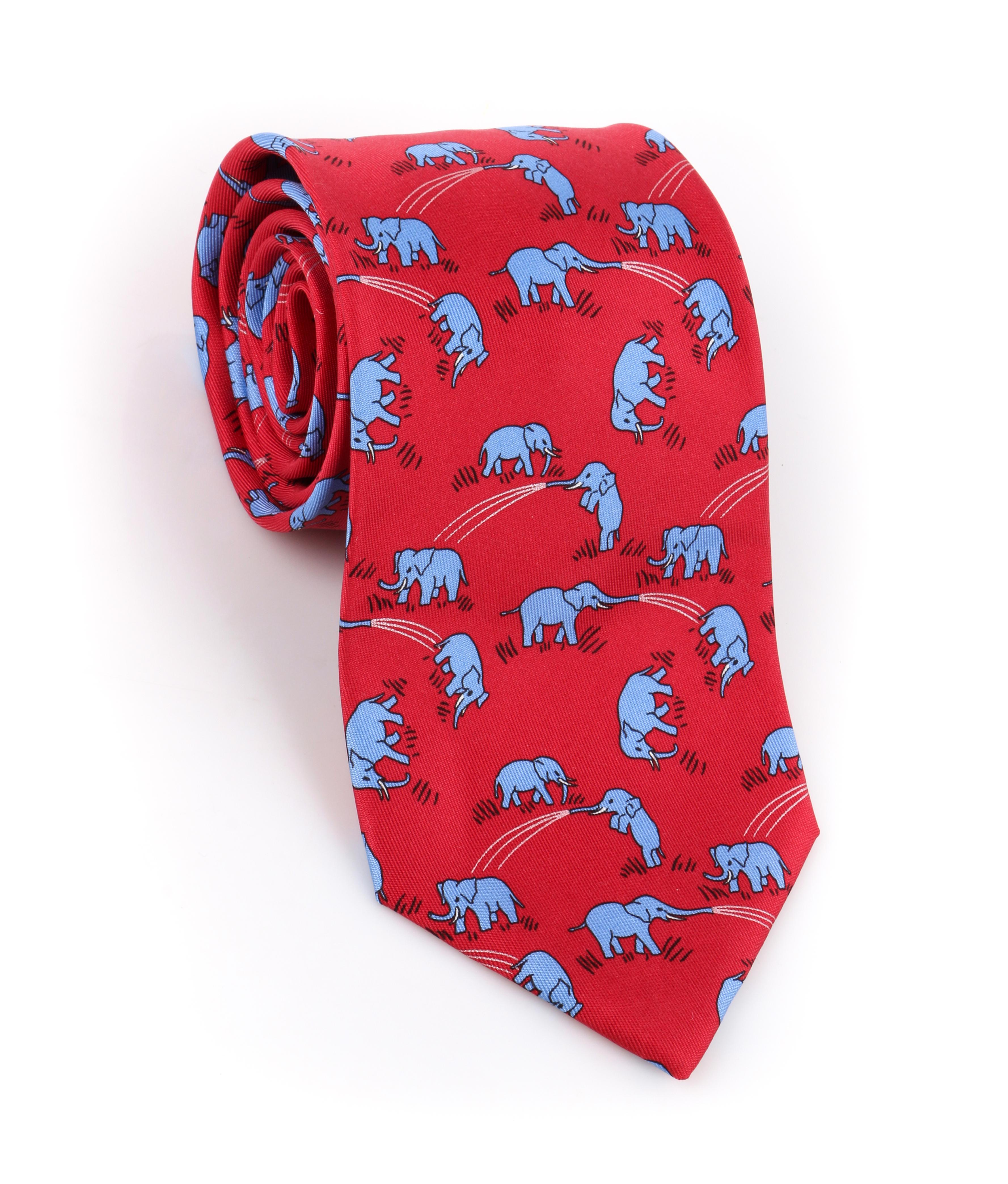 DESCRIPTION: HERMES Red & Blue Elephant Print 5 Fold Silk Necktie Tie 7111 OA
 
Brand / Manufacturer: Hermes
Collection: 
Designer: 
Manufacturer Style Name: 
Style: Necktie 
Color(s): Red, blue, black, and white
Lined: Yes
Marked Fabric Content: