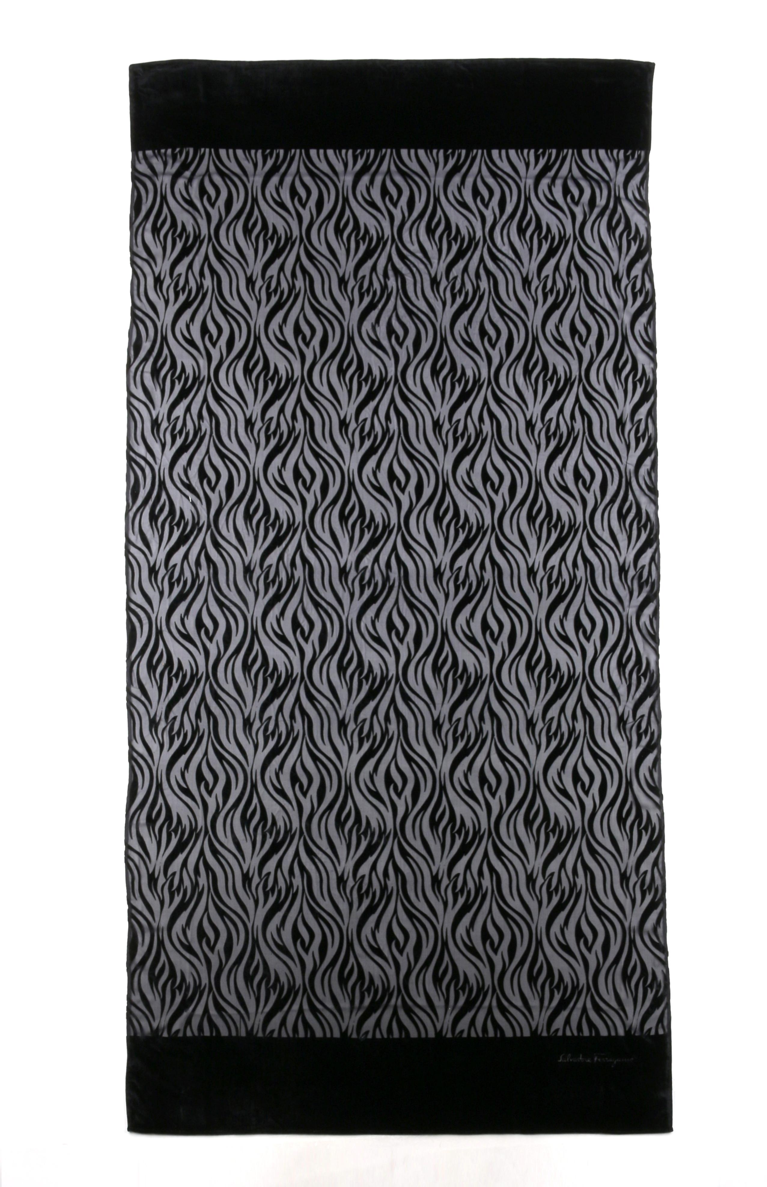 DESCRIPTION: SALVATORE FERRAGAMO Black Tiger Animal Stripe Velvet Burnout Oblong Silk Scarf
 
Brand / Manufacturer: Salvatore Ferragamo
Style: Oblong scarf
Color(s): Black
Lined: No
Marked Fabric Content: 82% Viscose, 18% Silk
Additional Details /
