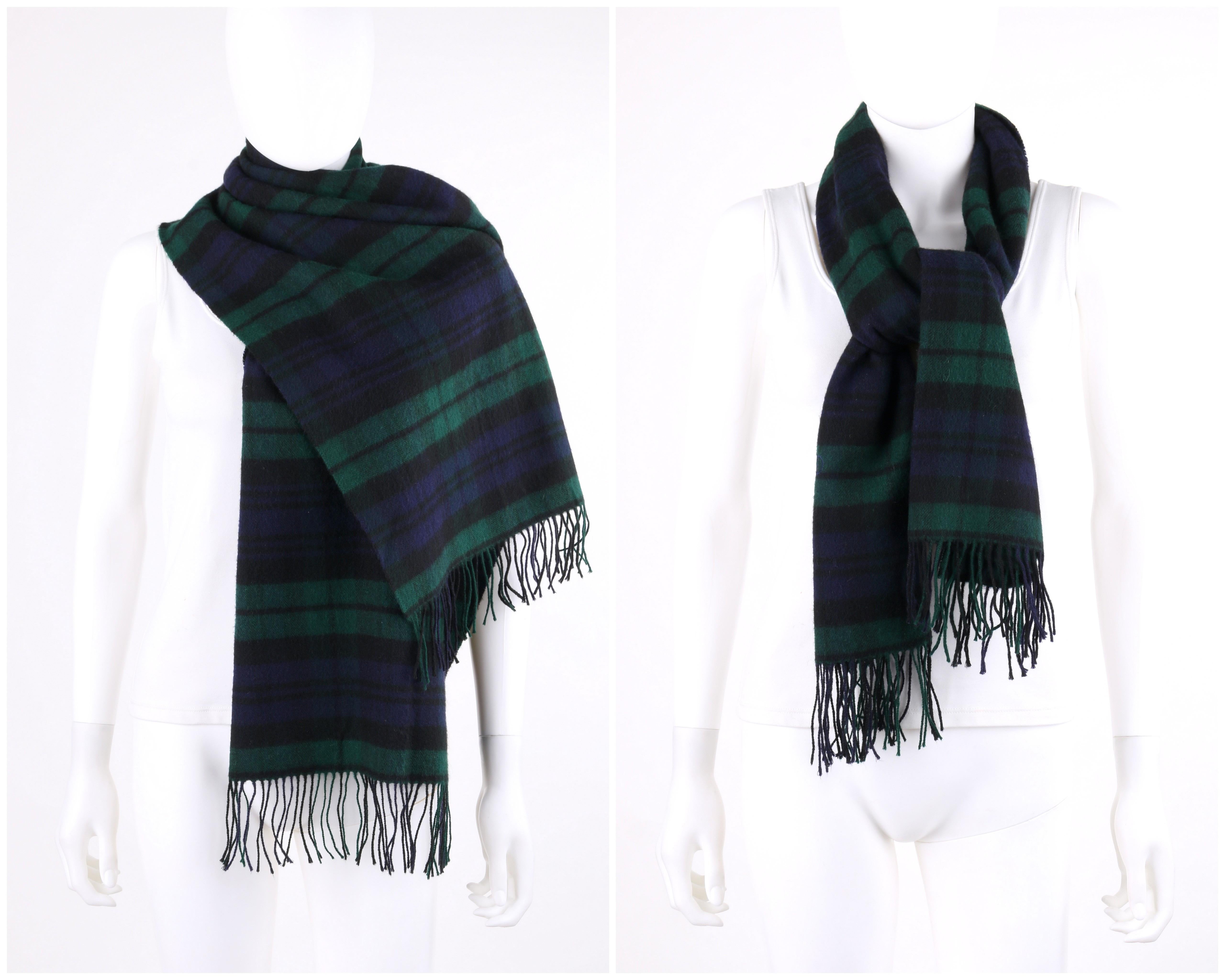 DESCRIPTION: GUCCI c.1980's Navy Blue & Green Tartan Plaid Cashmere Fringe Oblong Scarf
 
Circa: c.1980’s
Label(s): Made in Scotland for Gucci
Designer: 
Style: Oblong scarf
Color(s): Multi in shades of navy blue, green, and black
Lined: No
Marked