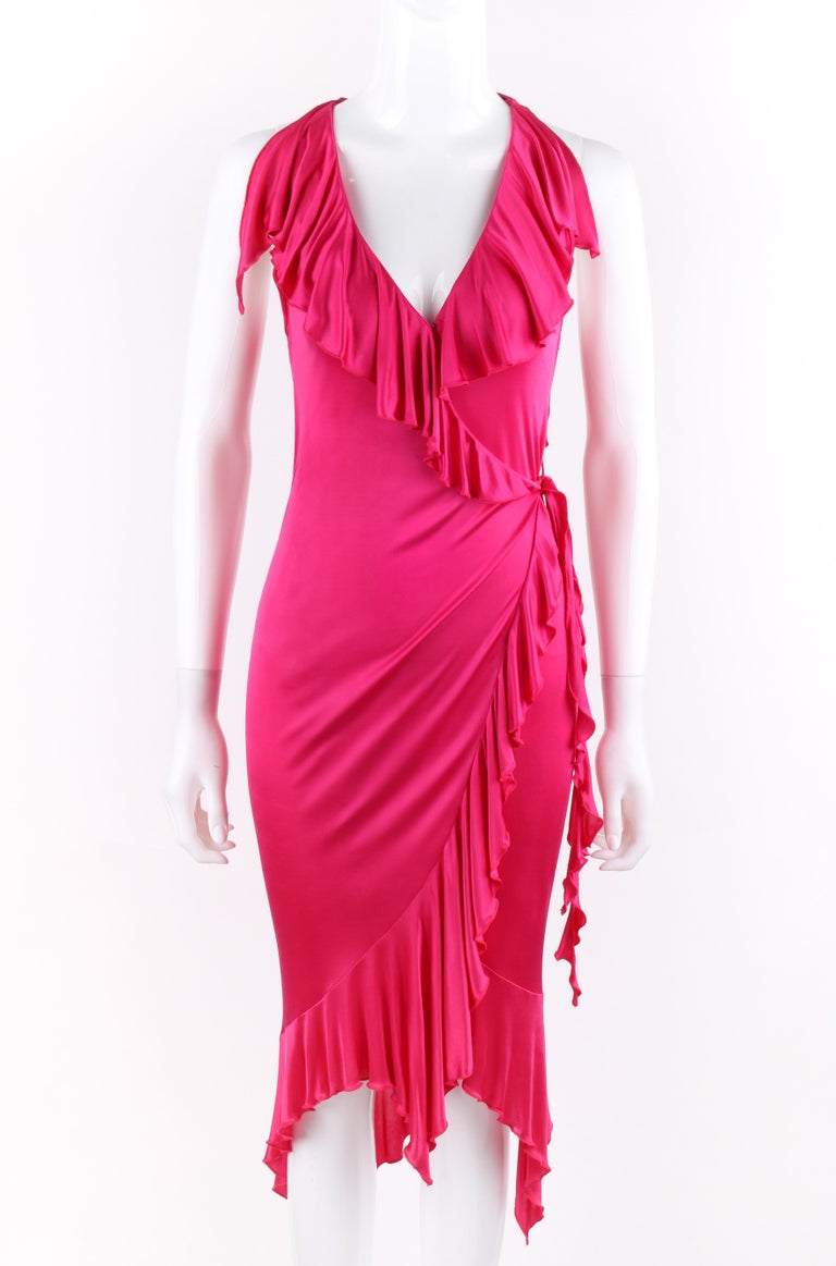DESCRIPTION: VERSACE S/S 2004 Hot Pink Knit V Neck Ruffle Wrap Dress
 
Brand / Manufacturer: Versace
Collection: Spring / Summer 2004; Runway look #45
Designer: Donatella Versace
Style: Wrap dress
Color(s): Hot pink 
Lined: No
Marked Fabric Content: