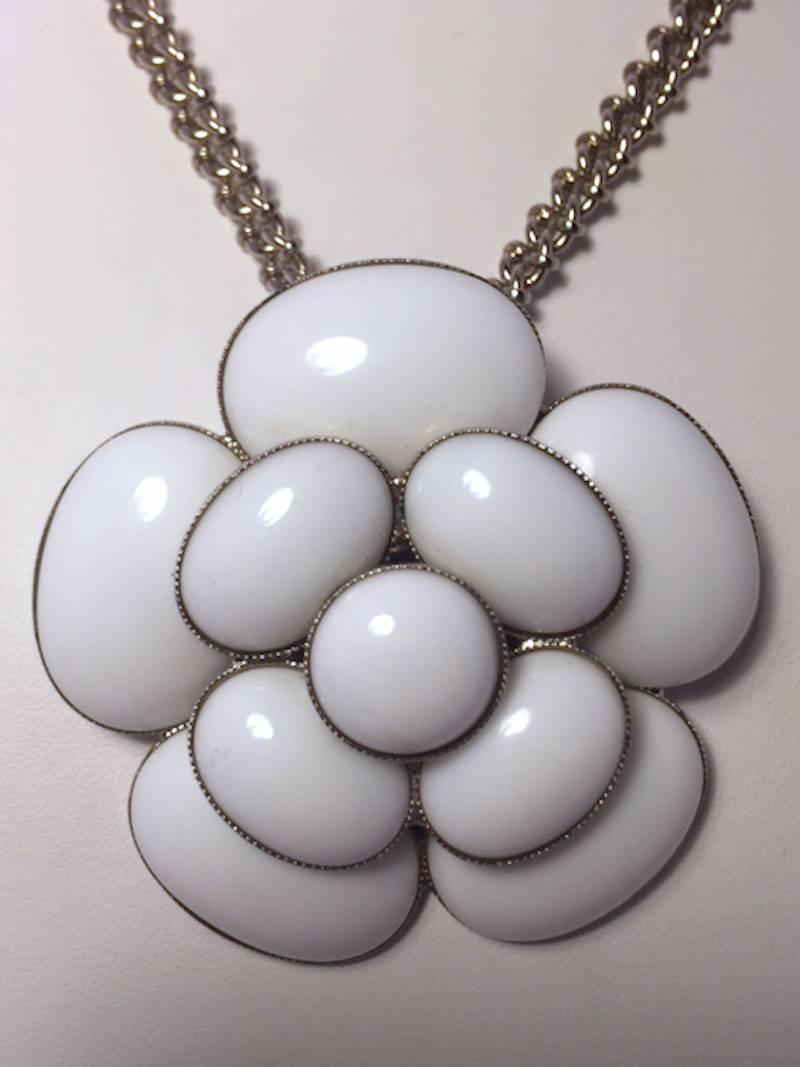 Chanel Gripoix white glass Camellia on silver plate chain necklace. From the Chanel 1998 cruise collection. Five small and five large Gripoix white glass cabochons set in silver form the 2.5 inch (6 cm.) diameter Camellia pendant. The silver chain