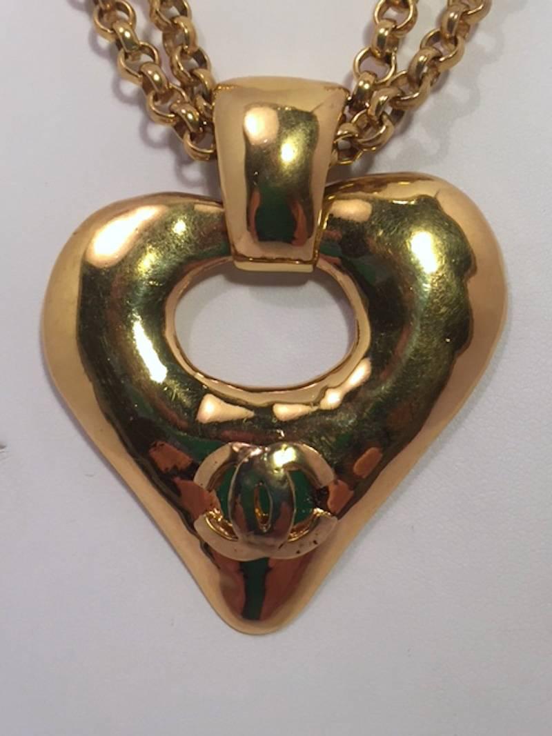 From the Chanel Spring 1993 collection. Gold double strand chain necklace with an open pendant pendant. Pendant measures 2.12 inches wide (5.5 cm) wide and 2.5 inches (6.5 cm) high including the bale. Pendant floats freely on two 1/4 inch (5 mm)
