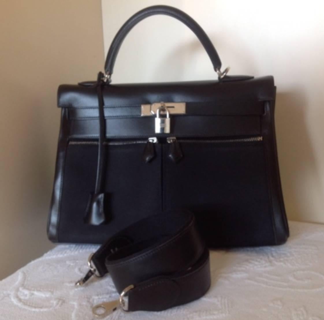 Hermes Kelly Lakis 32 Limited edition very hard to find.
Collector item, Leather black box Calf and canvas with Palladium Hardware
Has 3 zipper pockets two in front
And one reverse zipper  to the esteriore of the bag the bag in very good