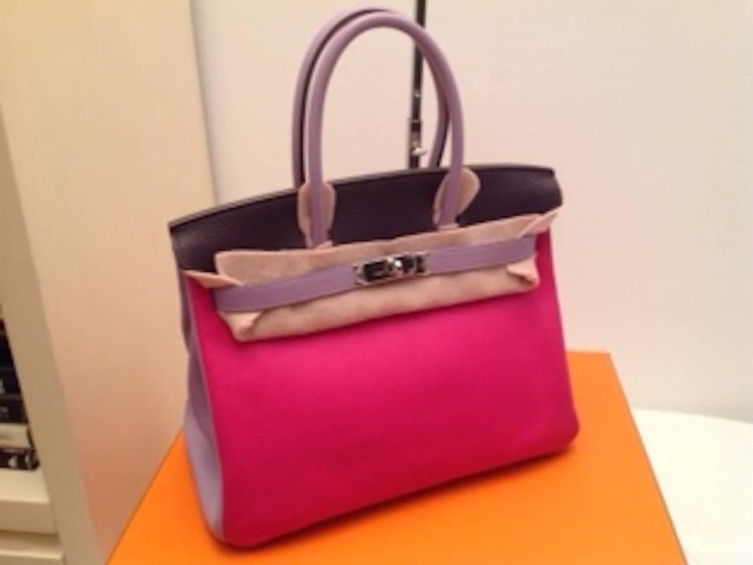 A rare and never used 3 color special order Hermes Birkin bag. Hermes no longer accepts custom or special orders in three colors, making this a rare bag. The colors of this bag are rose tyrian, lilac and raisin with matching stitching. Stamped with