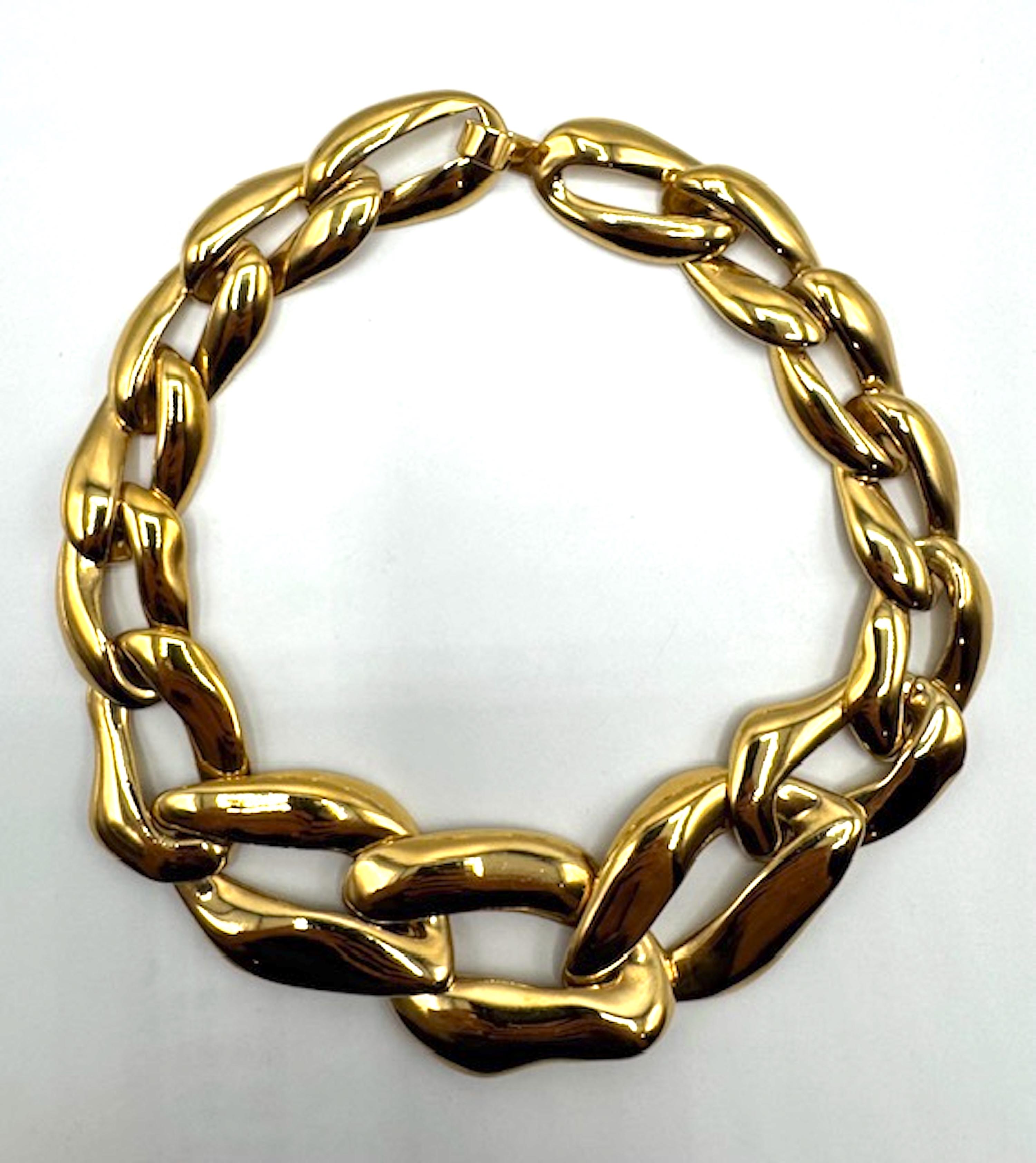 Yves Saint Laurent gold plate classic 1980s Limited  Edition design ( 166/401 ) .
The central and largest link is 1.75 inches high and 2.5 inches wide . From the center  link, each chain gradually get smaller toward the back of the necklace. There