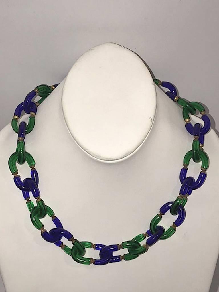 A lovely Archimede Seguso hand made glass chain necklace in blue and green colors circa 1970. The necklace measures 20 inches long. Each link is 6/8 of an inch wide and 1 3/8 inch long and made up of two pieces of U shape glass tubes. One in blue
