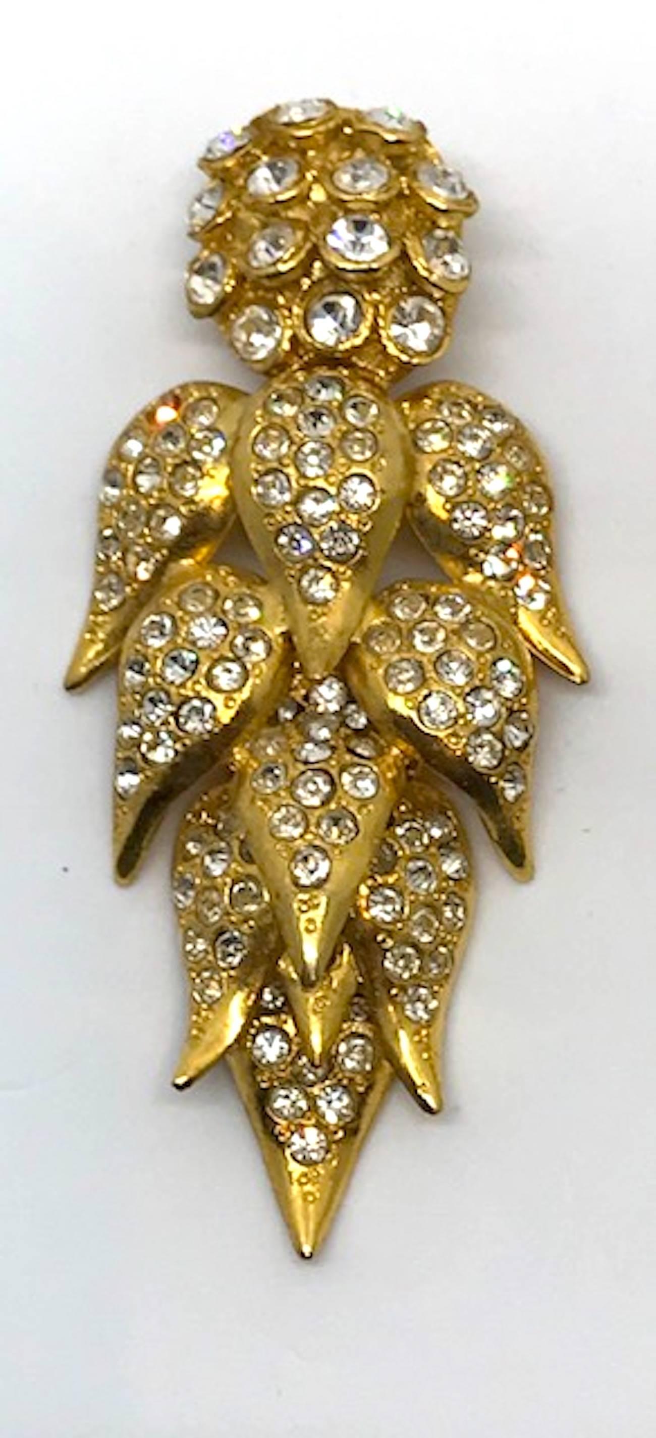 These show stopper 18K gilt and rhinestone leaf cluster earrings are from the personal collection of fine and costume jewelry of Italian actress Elsa Martinelli. Many of her pieces are by the fifty year old Italian jewelry company De Liguoro and