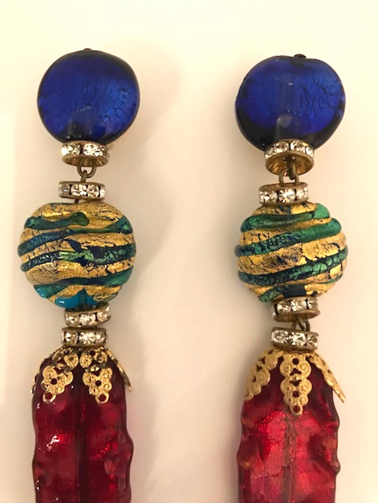 A lovely pair of Venetian glass bead and rhinestone rondelle pendant earrings from the 1980s. Part of the large collection of jewelry from this company owned by Elsa Martinelli. The red, blue and green glass bead are individually formed by hand with