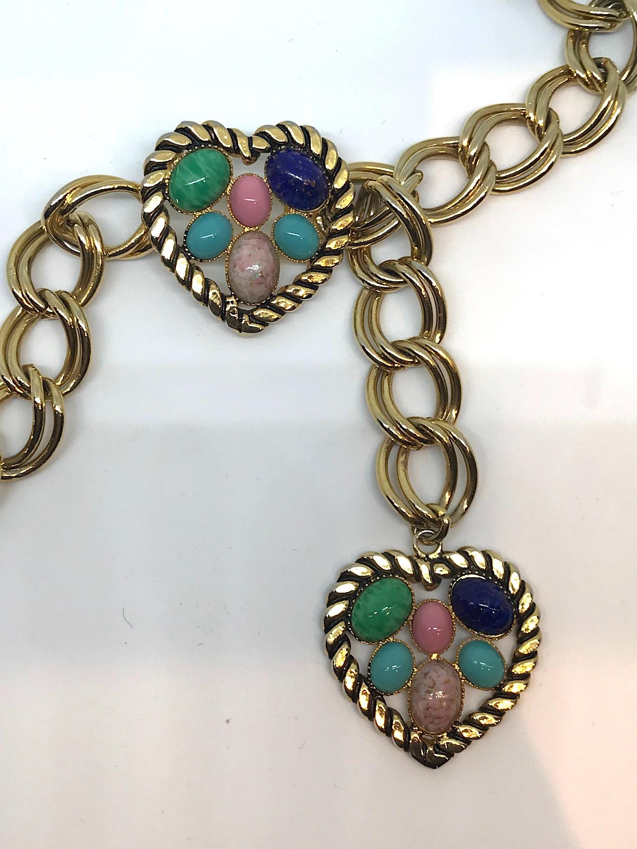 From the collection of fashionable actor Elsa Martinelli is this lovely gold tone double link belt 3/4 inch wide with two cabochon heart charms circa 1980/90. At on end is a heart pendant and at the opposite end is the hear charm with a hook clasp.