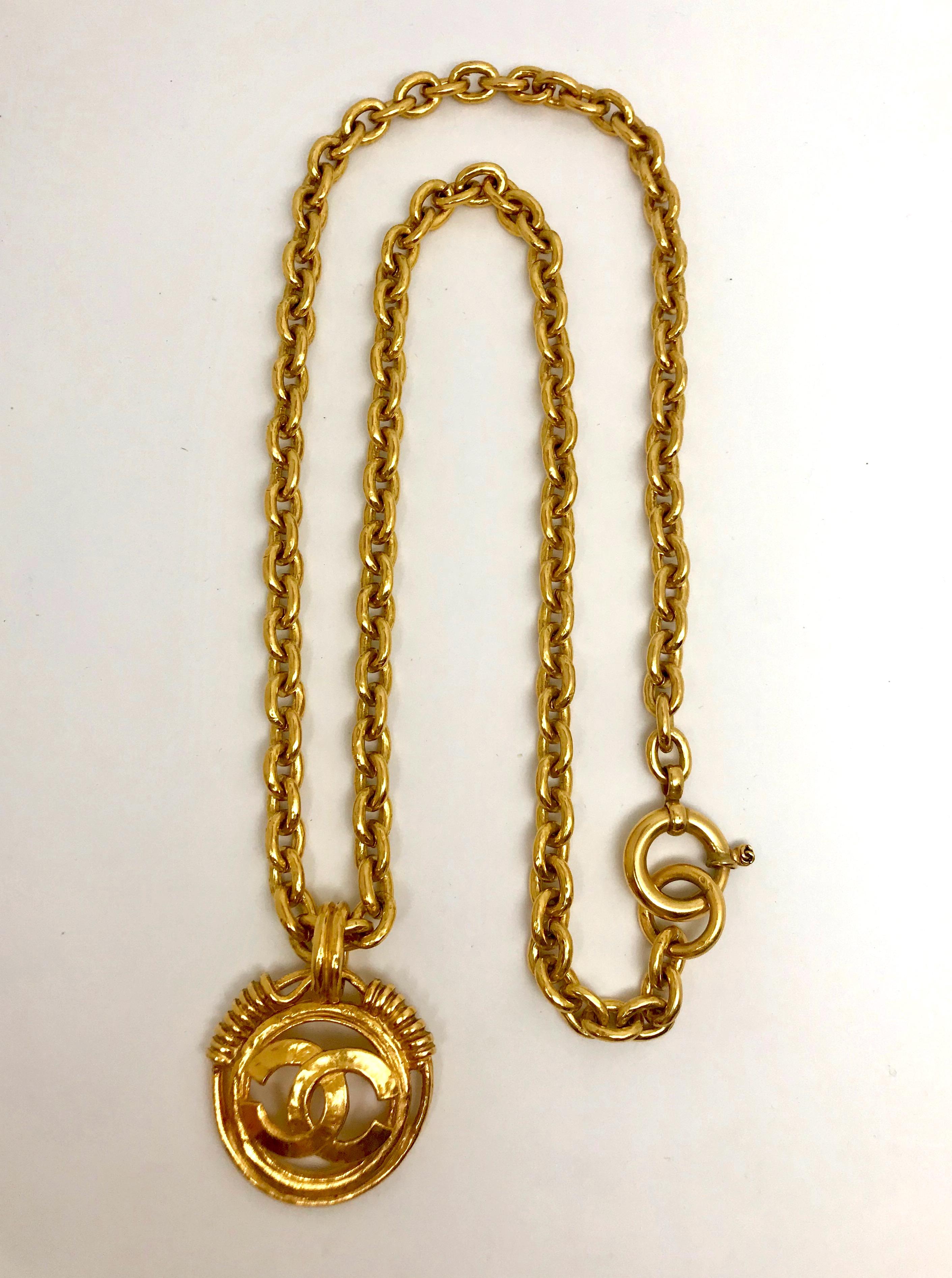 From the spring 1994 collection is this Chanel CC logo medallion pendant necklace with original rich gold patina. The round medallion measures 1.75