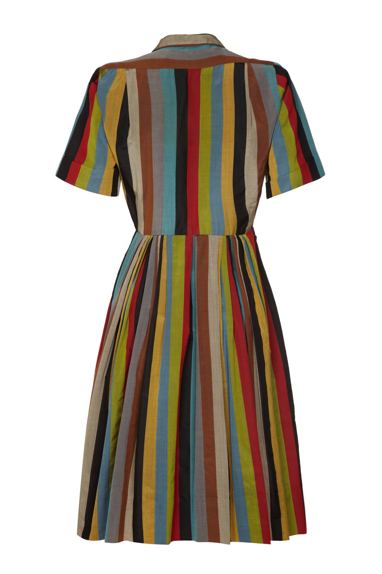 Very unusual vertically striped 1950s shirt dress from New York based retailer Peck & Peck. This lovely multi-coloured lightweight silk piece is typical of the style of the day with full, below the knee skirt, button fastening down the front and