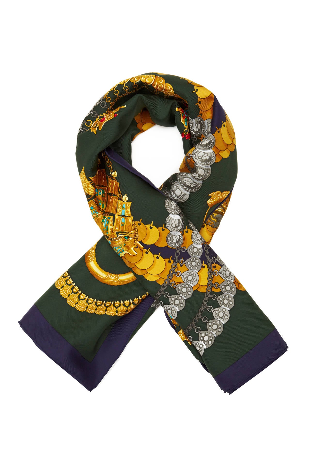 Beautiful dark green silk twill scarf with pretty chain and coin print. This scarf was designed by Julia Abadle and first issued in 1994/95 with reissues in 1997 and 1999. In excellent condition.

Measures 90cm x 90cm/ 35.5”x 35.5”