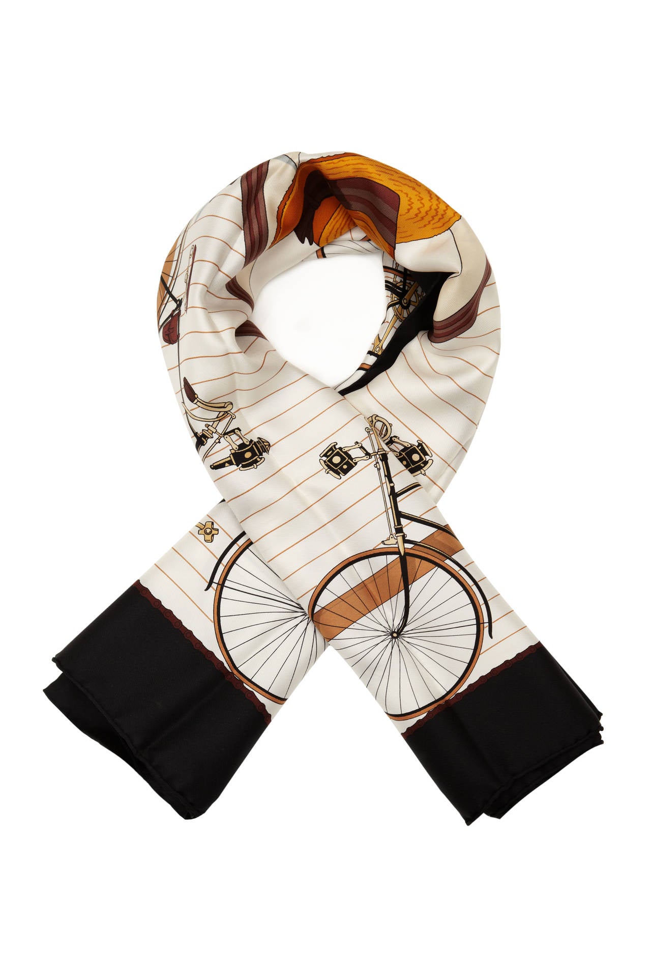 Beautiful black and cream silk twill scarf with bicycle print.  This scarf was designed by Hugo Grygkar and first issued in 1954 with reissues in 1973, 1990 and 2003. In excellent condition. 

Measures 90cm x 90cm/ 35.5”x 35.5”