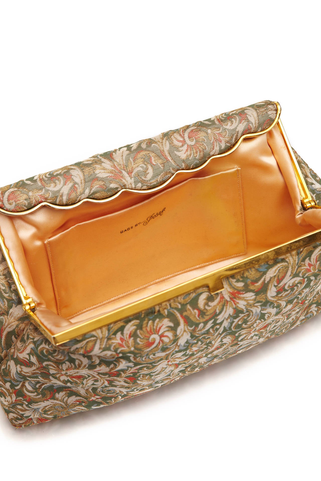 Gorgeous little brocade clutch bag with pretty swirling floral pattern woven with gold lame, pale green, cream and coral. Fully lined in pale peach silk with separate, original coin purse and mirror and two extra internal pockets.  In pristine