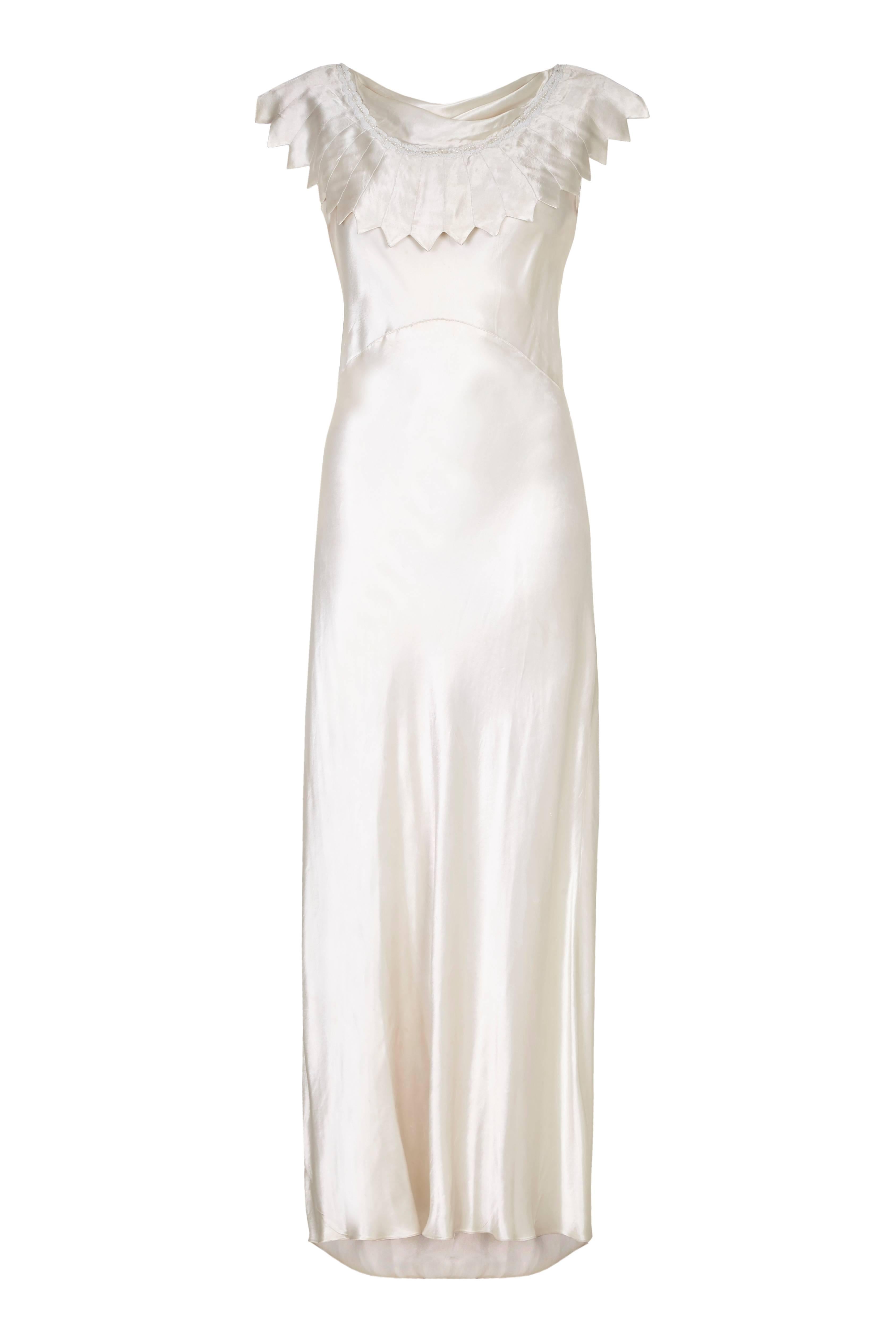 Amazing vintage 1930s bias cut ivory silk satin wedding dress with fabulous decorative collar around the front and scooping down to follow the shape of the low back.  At the front there is also the addition of small cowl neck and some dainty white