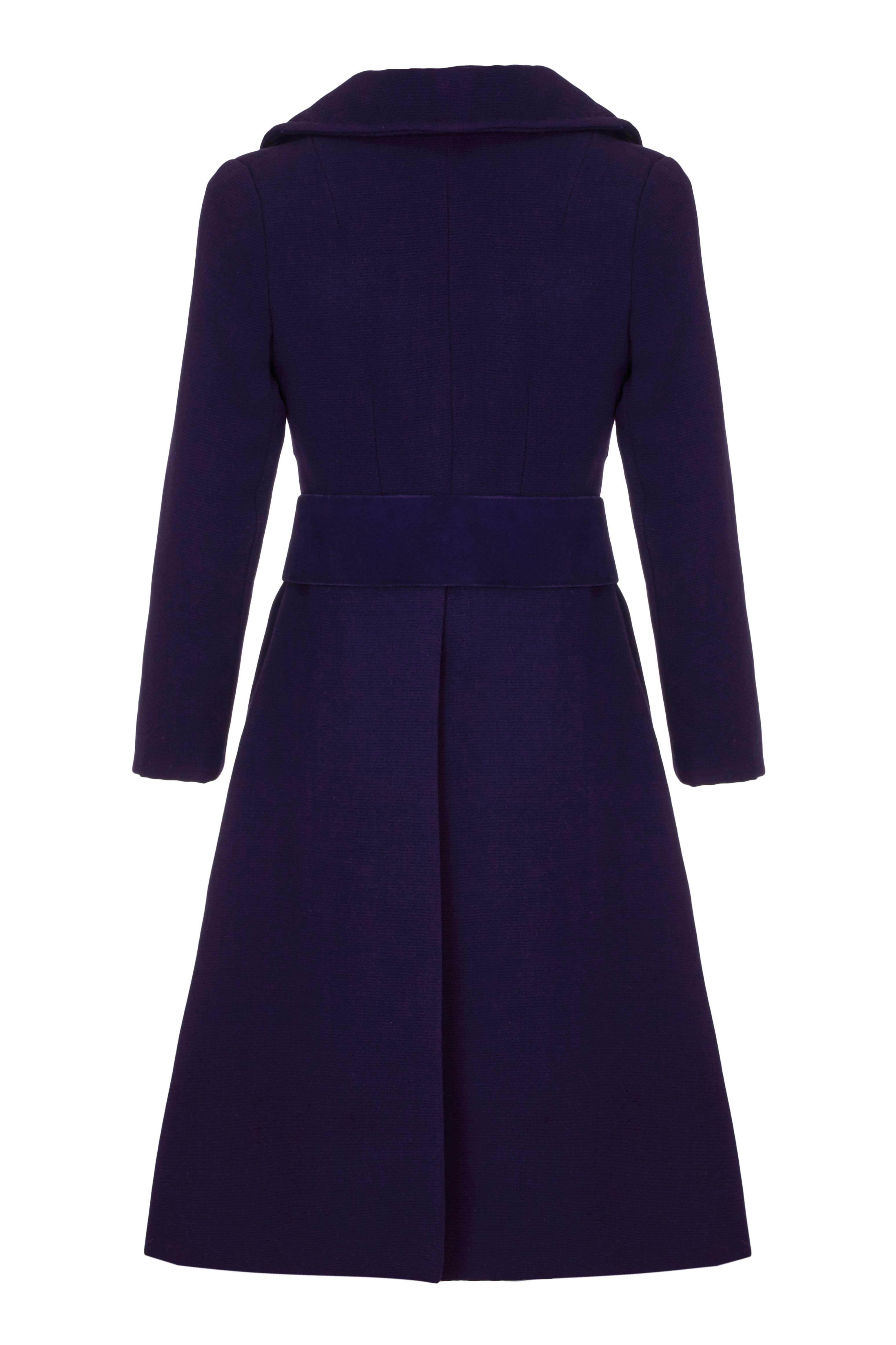Gorgeous vintage mid to late 1960s haute couture purple wool coat, which is most likely to be a Pierre Cardin or Andre Courreges although unfortunately there is no label.  It comes with original matching hand made wide suede belt with large silver